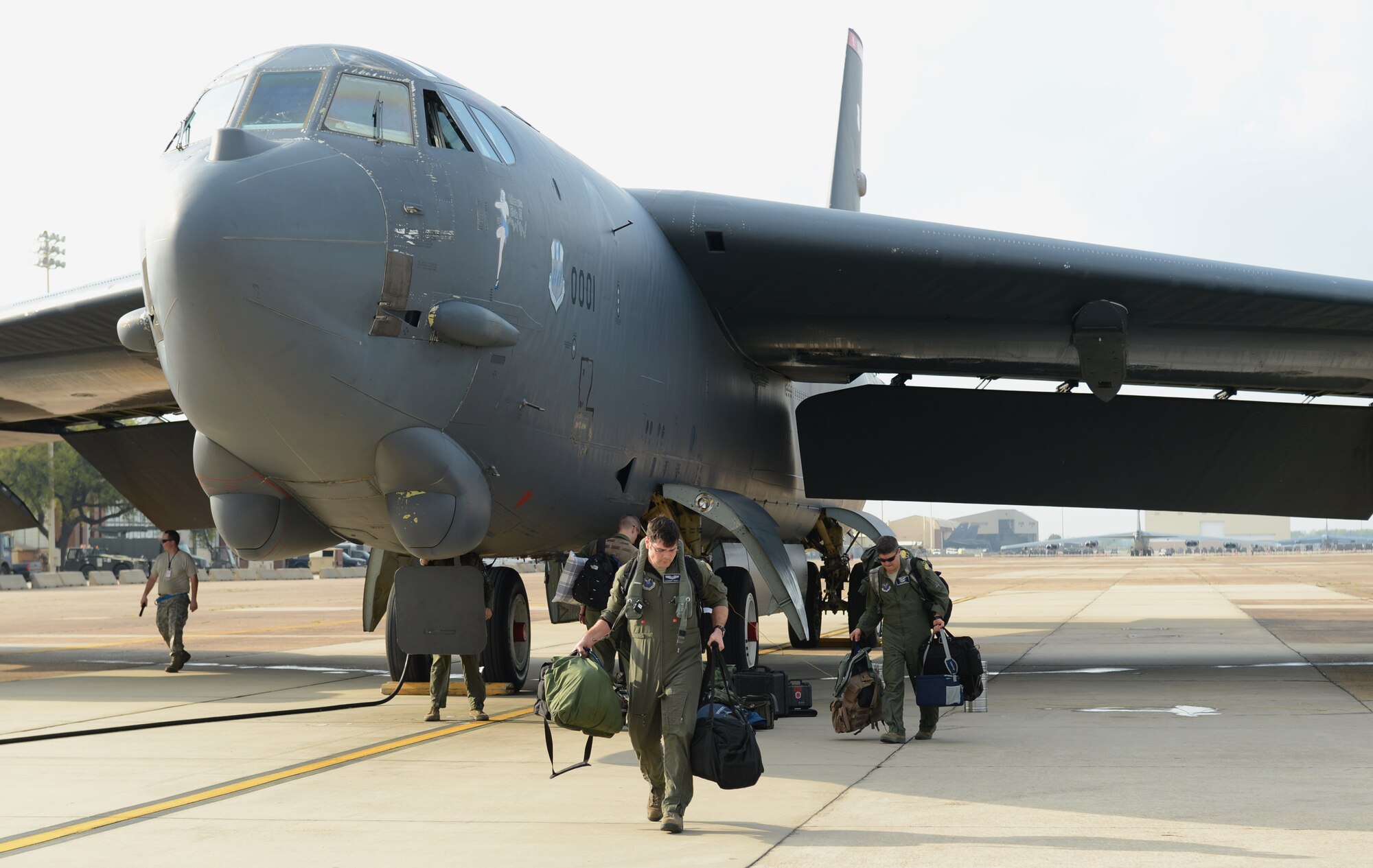 An aircrew from the 2nd Bomb Wing exits their B-52H Stratofortress aircraft on Barksdale Air Force Base, La., April 2, 2015. In support of a long-range mission to the Arctic and North Sea regions, the mission called "Polar Growl" helped ensure the bomber crews maintain a high state of readiness and proficiency and demonstrate their ability to provide a flexible and always-ready, global-strike capability. (U.S. Air Force photo/Senior Airman Benjamin Gonsier)