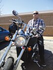 Air Force Staff Sgt. Craig Mullen, a C-130 crew chief for Kirtland’s 58th Special Operations Wing, sits on his motorcycle on Albuquerque’s west side Monday. Mullen has been recommended for the Airman’s Medal in recognition of actions that saved the life of a gunshot victim and his aid to police in apprehending the alleged assailants. (Photo by Ryan Stark)
