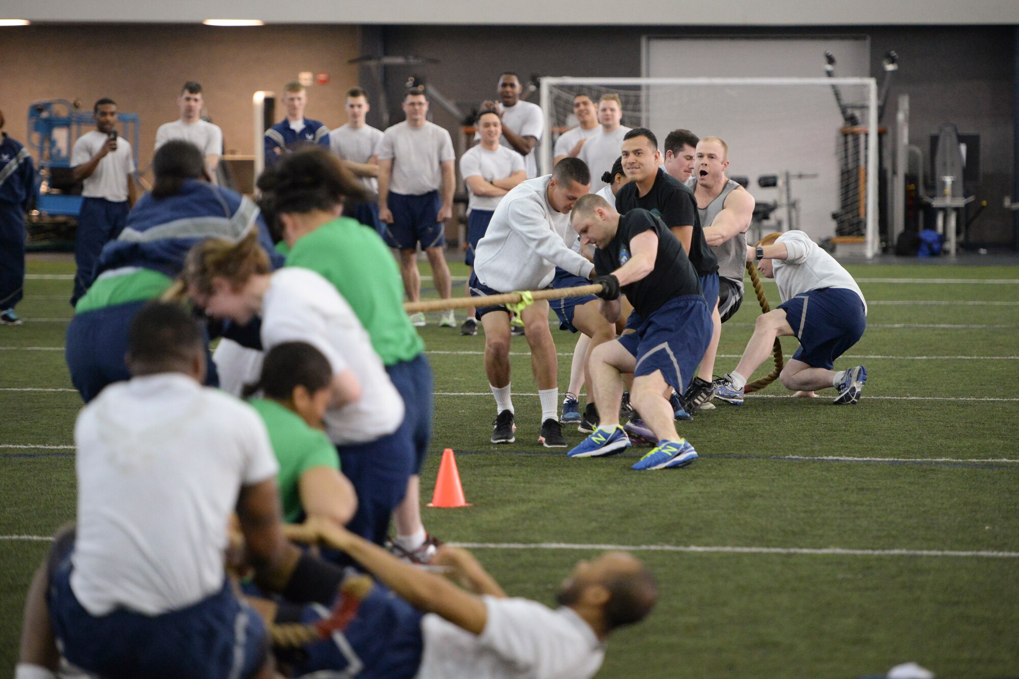 Airmen assigned to the 354th Force Support Squadron and the 354th Logistics Readiness Squadron compete against each other during a 354th Fighter Wing Sports Day tug-of-war competition at Eielson Air Force Base, Alaska, March 30, 2015. The 354th Security Forces Squadron pulled their way to first place in the event. (U.S. Air Force photo by Senior Airman Peter Reft/Released)