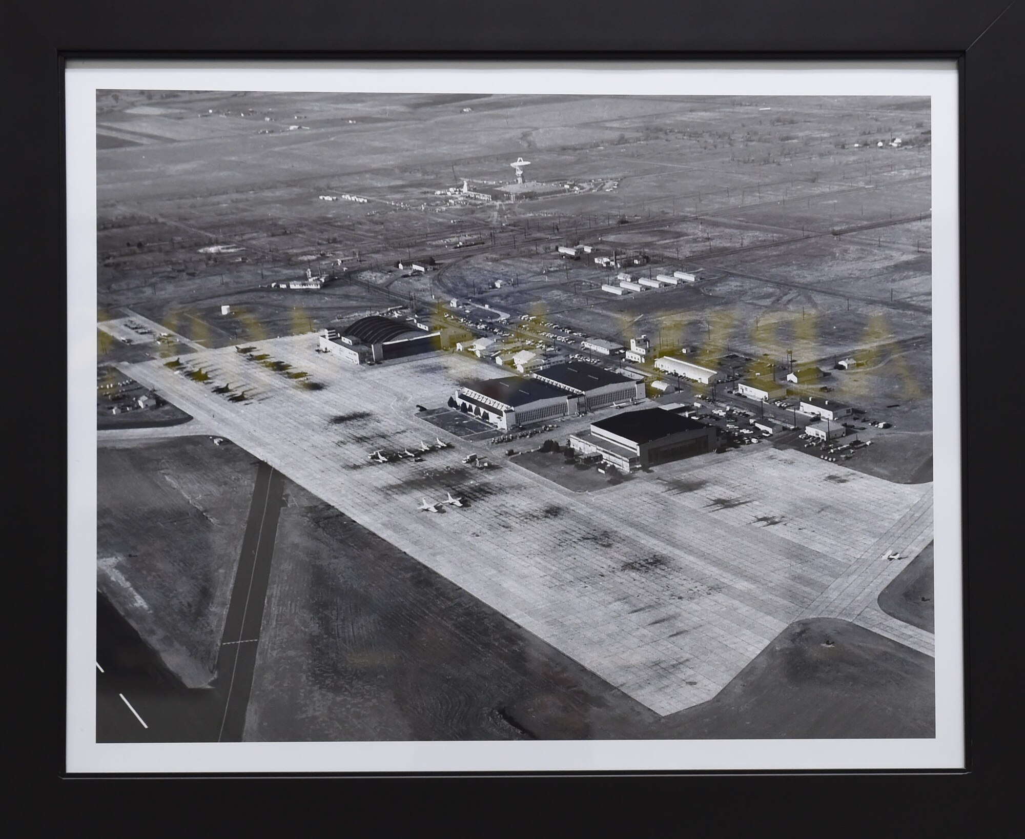 An aerial view of the Buckley Air National Guard Base flight line in 1967. The main gate is located near the top right corner of the image. A satellite complex is at the top of the image. (Courtesy Photo)