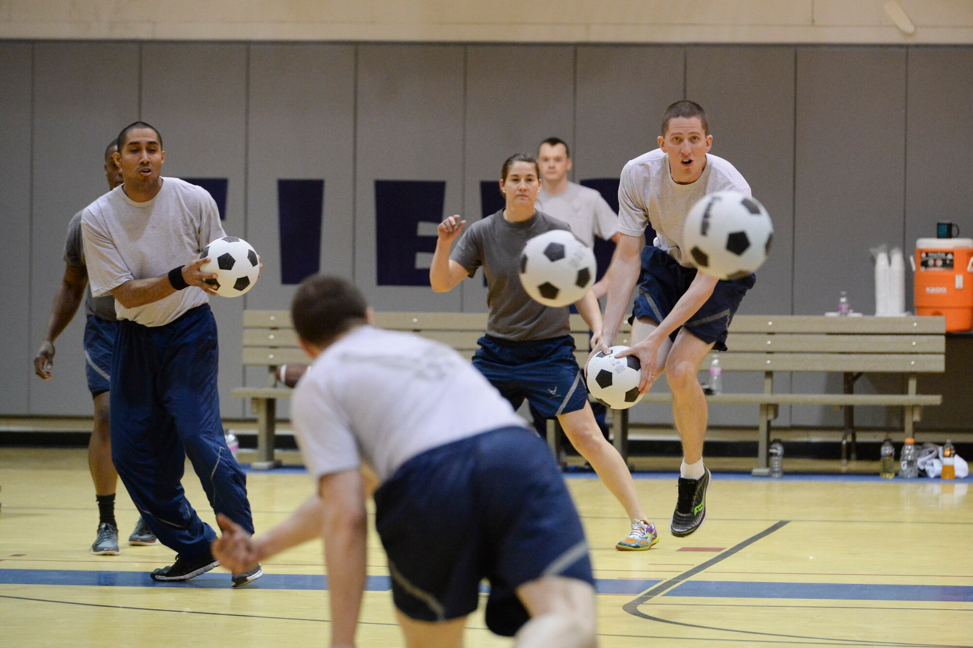 Eielson Airmen compete against each other during the 354th Fighter Wing Sports Day dodgeball tournament at Eielson Air Force Base, Alaska, March 30, 2015. Sports Day gave Airmen from different squadrons a chance to test their skills in a variety of sporting events. (U.S. Air Force photo by Senior Airman Peter Reft/Released)
