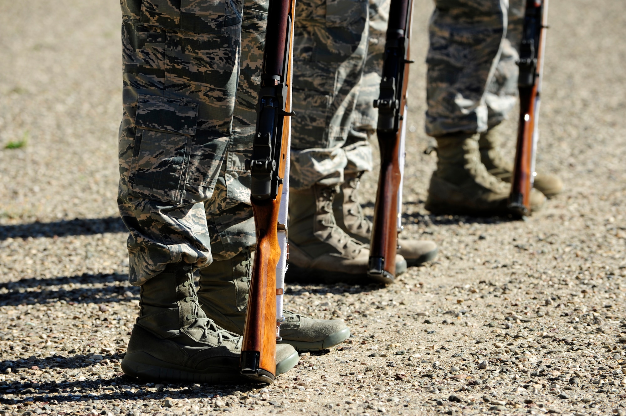 Members of the Vandenberg Honor Guard pay respect by presenting arms in a demonstration of a funeral ceremony during training March 25, 2015, Vandenberg Air Force Base, Calif. Honor guardsmen promote the Air Force mission by showcasing drill performances at public and military venues. (U.S. Air Force photo by Staff Sgt. Jim Araos/Released)