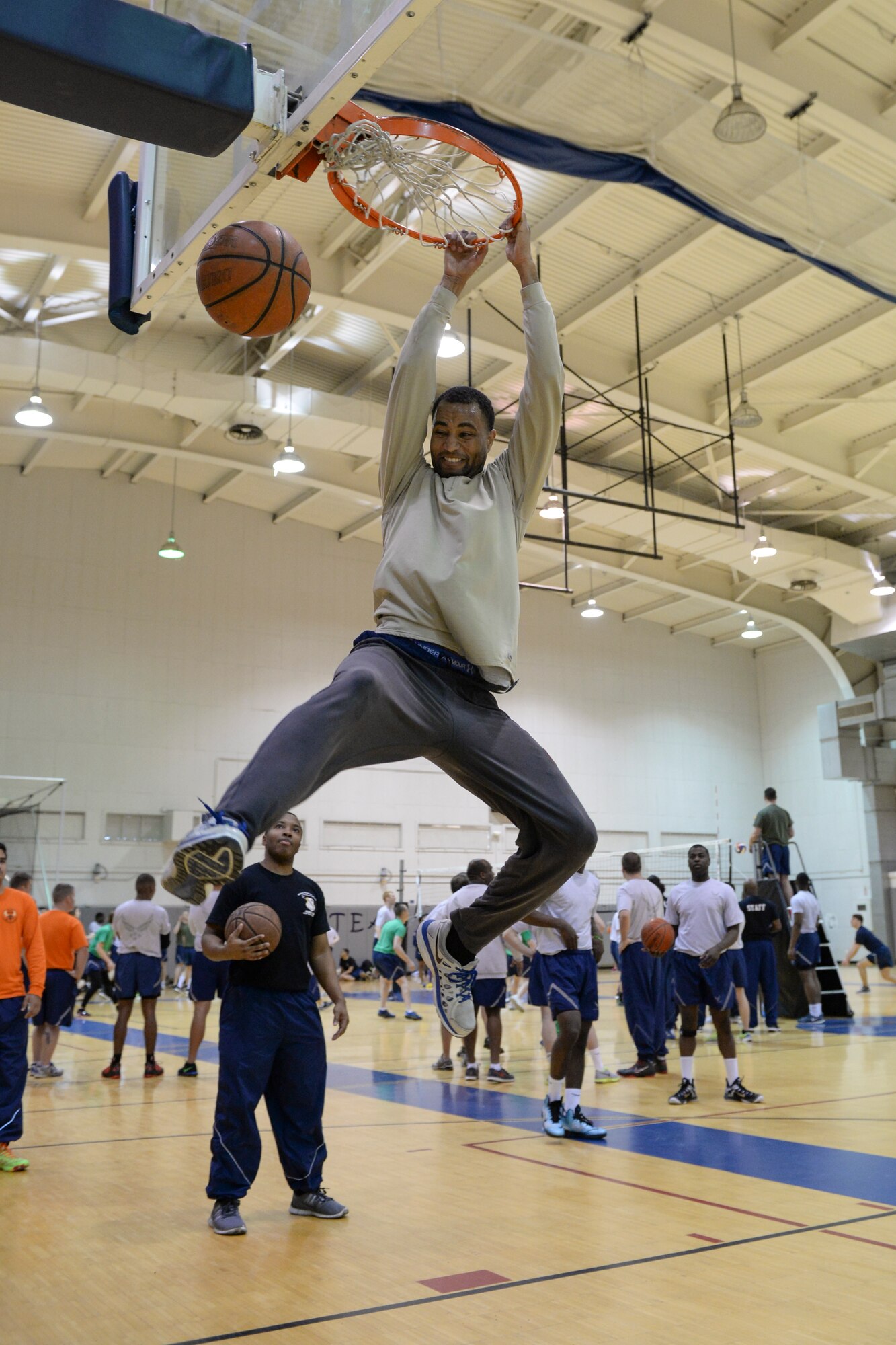 U.S. Air Force Airman 1st Class Bryan Wallace dunks a basketball during a 354th Fighter Wing Sports Day basketball event at Eielson Air Force Base, Alaska, March 30, 2015. Teams from different squadrons at Eielson competed against one another in various sporting events. (U.S. Air Force photo by Senior Airman Peter Reft/Released)