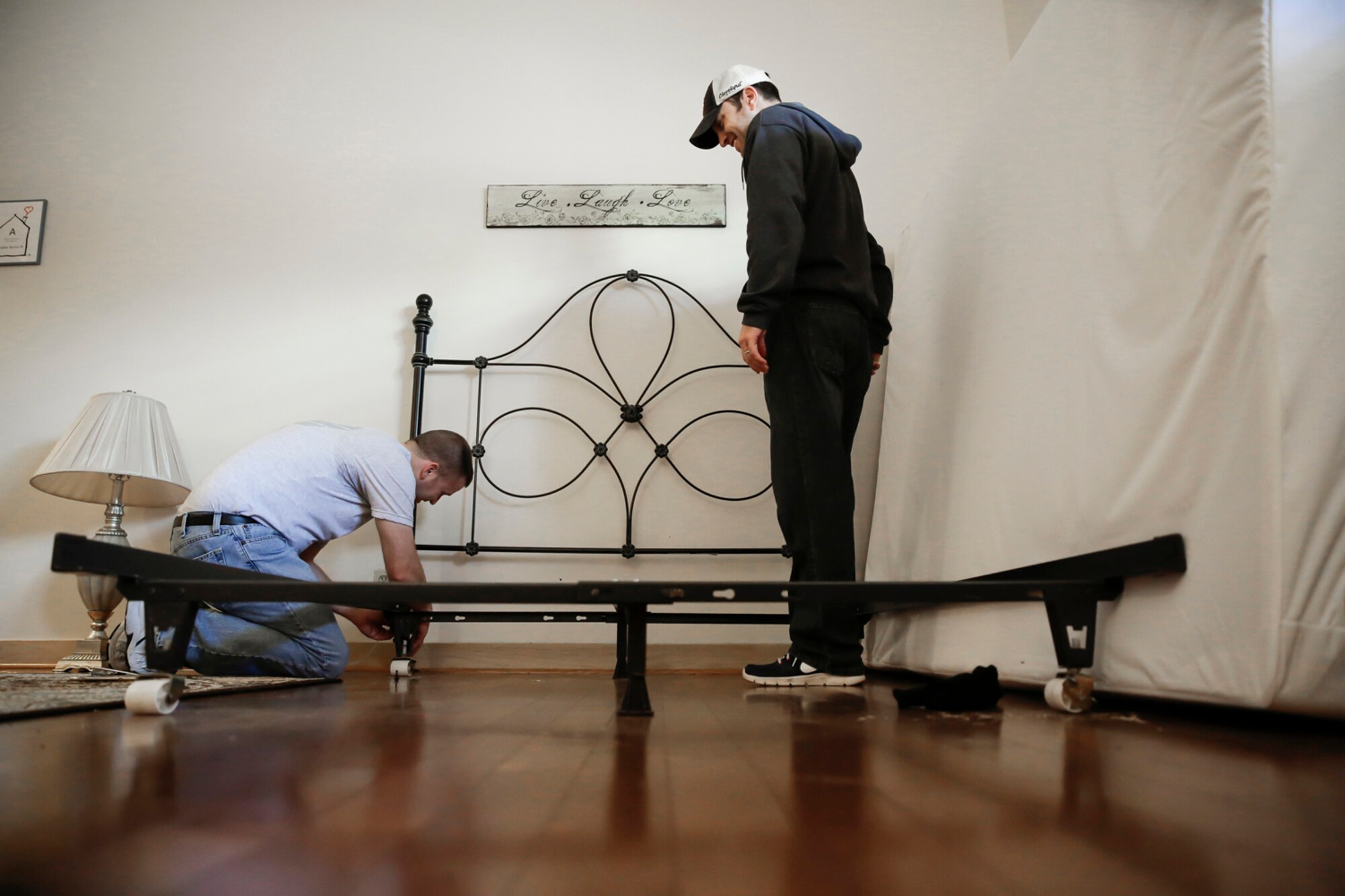 Members of the 138th Fighter Wing (FW) assemble new bed frames March 29, 2015, at the Ronald McDonald House of Tulsa.  Volunteers from the 138th Fighter Wing assisted at the house upon the arrival of a large shipment new beds and mattresses. (U.S. National Guard photo by Master Sgt. Mark A. Moore/Released)