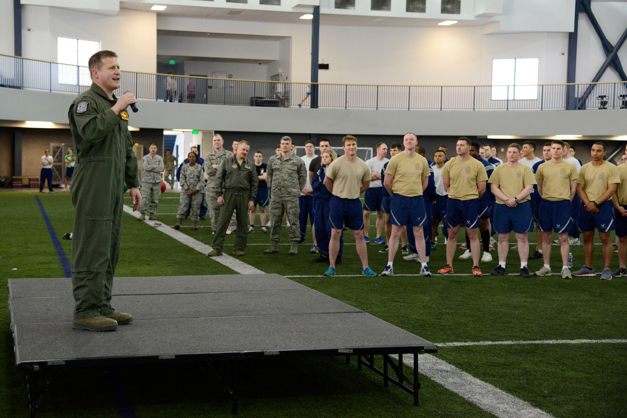 U.S. Air Force Col. Michael Winkler, the 354th Fighter Wing commander, speaks to sports day participants at Eielson Air Force Base, Alaska, March 30, 2015. The day's events included flag football, volleyball, tug-of-war, dodgeball and other various sporting events. (U.S. Air Force photo by Senior Airman Racheal E. Watson/Released)