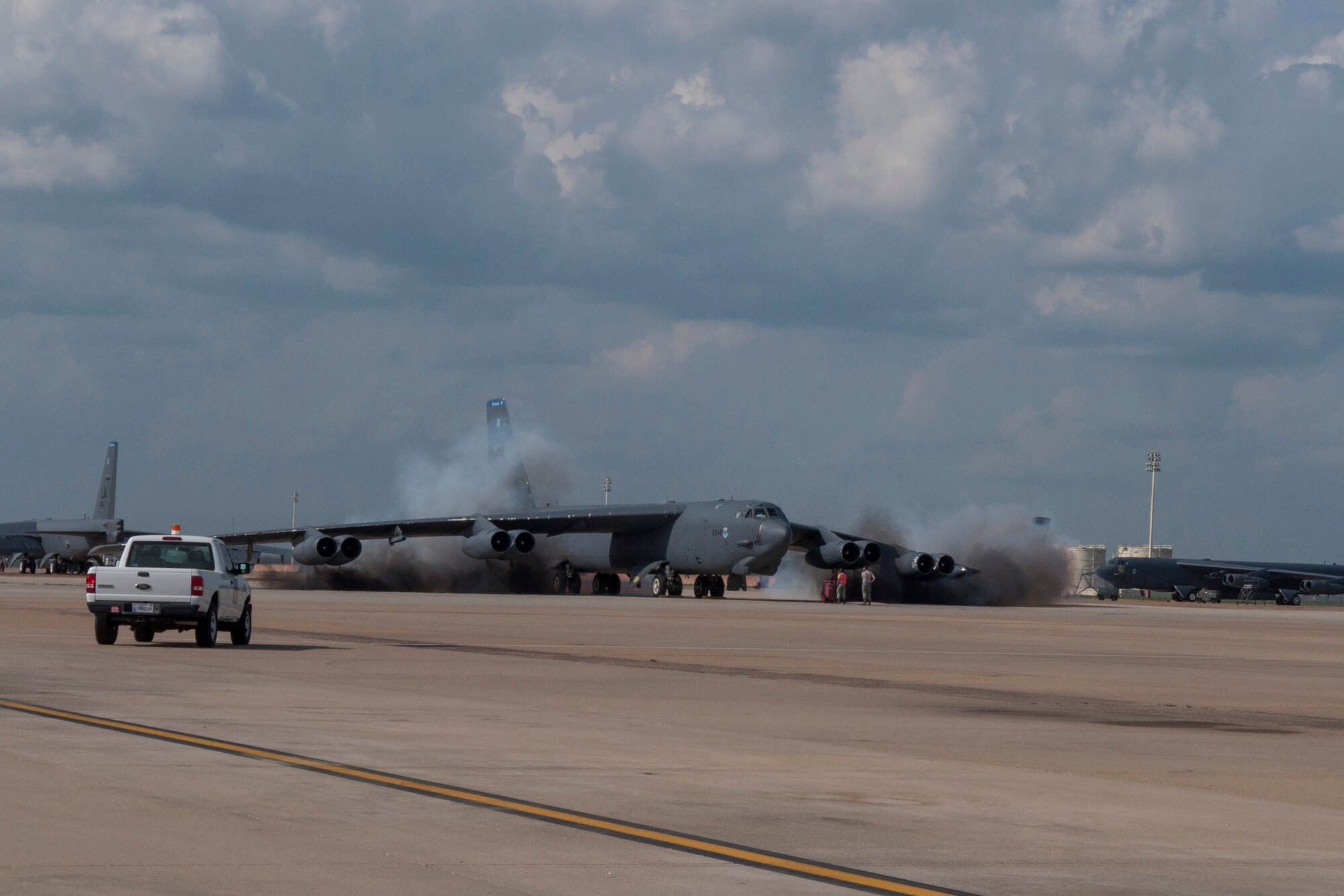 U.S. Air Force Maintainers from the 2nd Bomb Wing look on as a B-52 Stratofortress starts their engines on Barksdale Air Force Base, La. April 1, 2015. The B-52, manned by aircrew from the 307th Bomb Wing is part of Exercise “Polar Growl.” These aircraft will conduct simultaneous, long-range sorties from Barksdale to the Arctic and North Sea regions. Bomber missions such as these ensure bomber crews maintain a high state of readiness and proficiency and demonstrate their ability to provide a flexible and always-ready global-strike capability. (U.S. Air Force photo by Master Sgt. Dachelle Melville/Released)