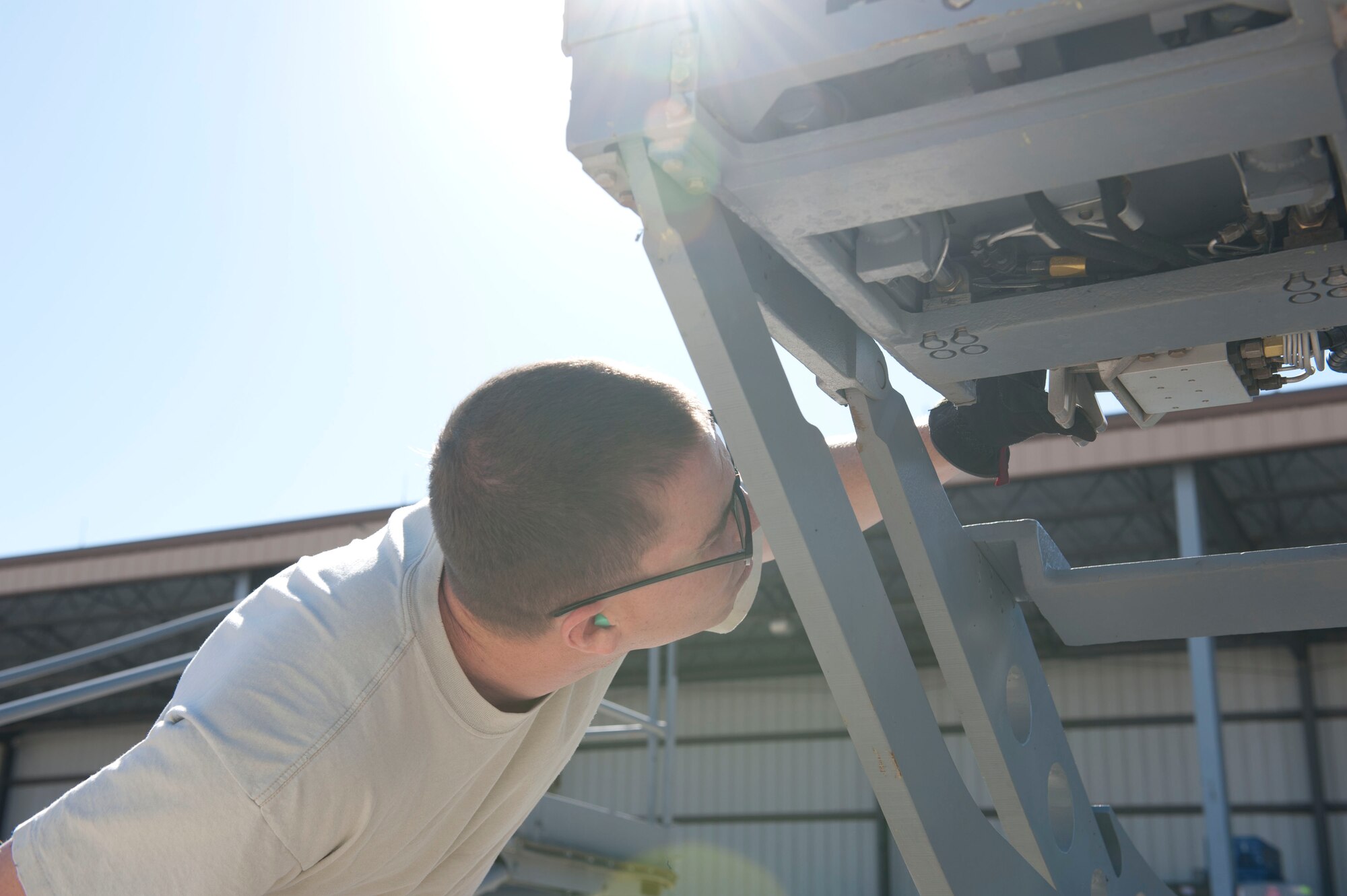 Senior Airman Scott Gray, 49th Maintenance Squadron Aerospace Ground Equipment journeyman, checks the MJ-1B/C Bomblift’s table during a service inspection at Holloman Air Force Base, N.M. April 1, 2015. Bomblifts, known throughout the Air Force as a jammer, are used to assist with moving and loading bombs and weapons onto aircraft for training and real world operations. (U.S. Air Force photo by Staff Sgt. E’Lysia A. Wray/Released)