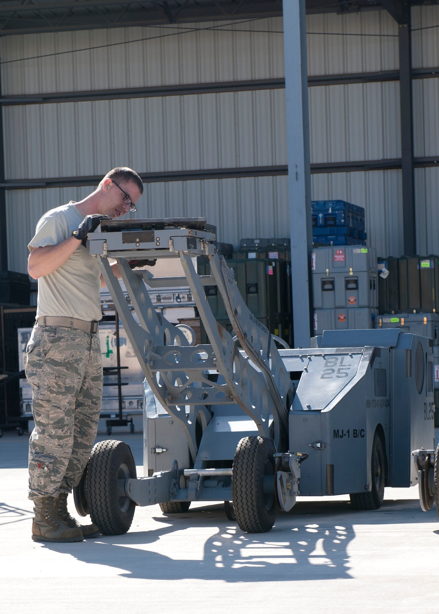 Senior Airman Scott Gray, 49th Maintenance Squadron Aerospace Ground Equipment journeyman, checks the MJ-1B/C Bomblift’s table during a service inspection at Holloman Air Force Base, N.M. April 1, 2015. Bomblifts, known throughout the Air Force as a jammer, are used to assist with moving and loading bombs and weapons onto aircraft for training and real world operations. (U.S. Air Force photo by Staff Sgt. E’Lysia A. Wray/Released)