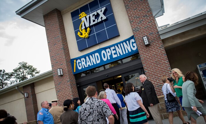 Members of Joint Base Charleston enter the newly opened student Naval Exchange April 1, 2015, on Naval Weapons Station Charleston, S.C. Students attending the Naval Nuclear Power Training Command school have very busy lives. By building the student NEX next to the NNPTC campus, it is much more convenient for students carrying heavy course loads to shop for needed items.  The student NEX is also located nearby other establishments focused on the students’ needs.  (U.S. Air Force photo/Airman 1st Class Clayton Cupit)