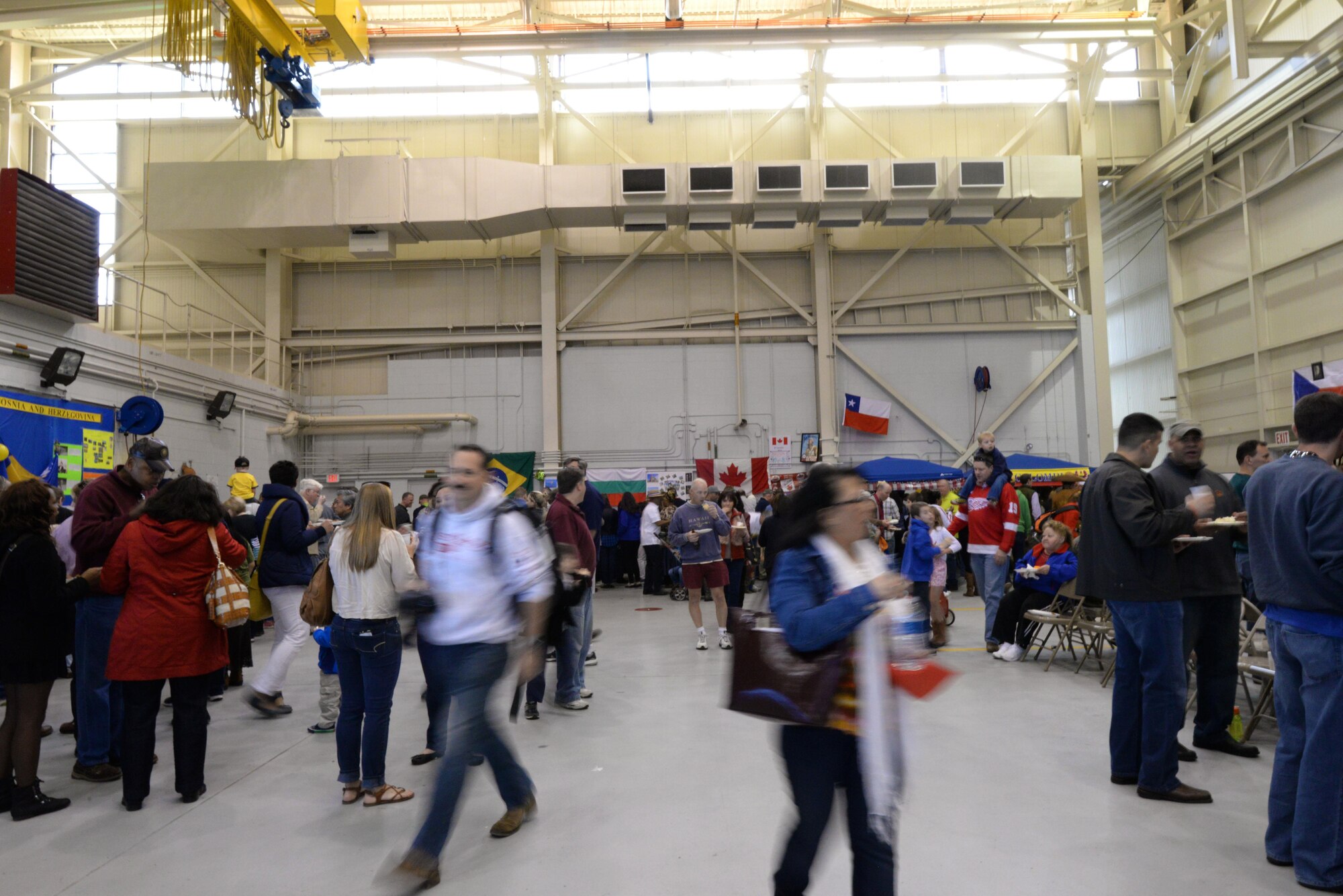 Attendees explore the 62 different cultures displayed at the International Culture Day March 23, 2015 at Maxwell Air Force Base, Alabama. The 111 international officers at Air War College and Air Command and Staff College shared their cultures and customs with their fellow students through food, dress, music and language to promote understanding and strengthen partnerships. (U.S. Air Force photo by Airman 1st Class Alexa Culbert)