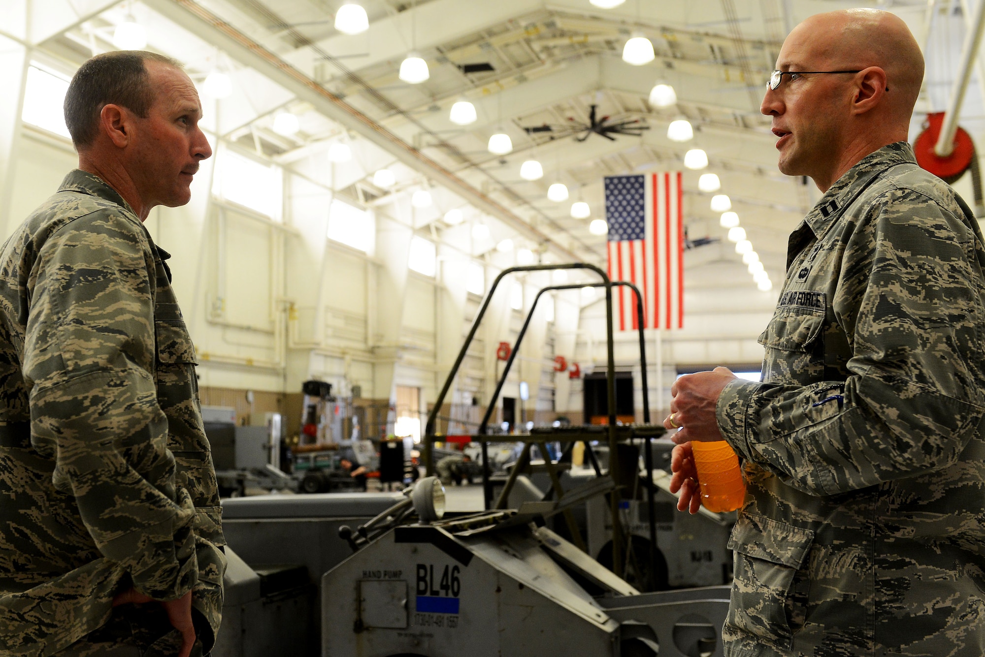 U.S. Air Force Col. Stephen Jost, 20th Fighter Wing commander, and Chaplain (Capt.) Curt Cizek, 20th FW chaplain, talk about the integration of chaplains into squadrons at Shaw Air Force Base, S.C., March 16, 2015. The chaplains are broken up into religious support teams, which consist of a chaplain and chaplain assistant who are paired up and integrated into a unit on base. (U.S. Air Force photo by Senior Airman Diana M. Cossaboom/Released)