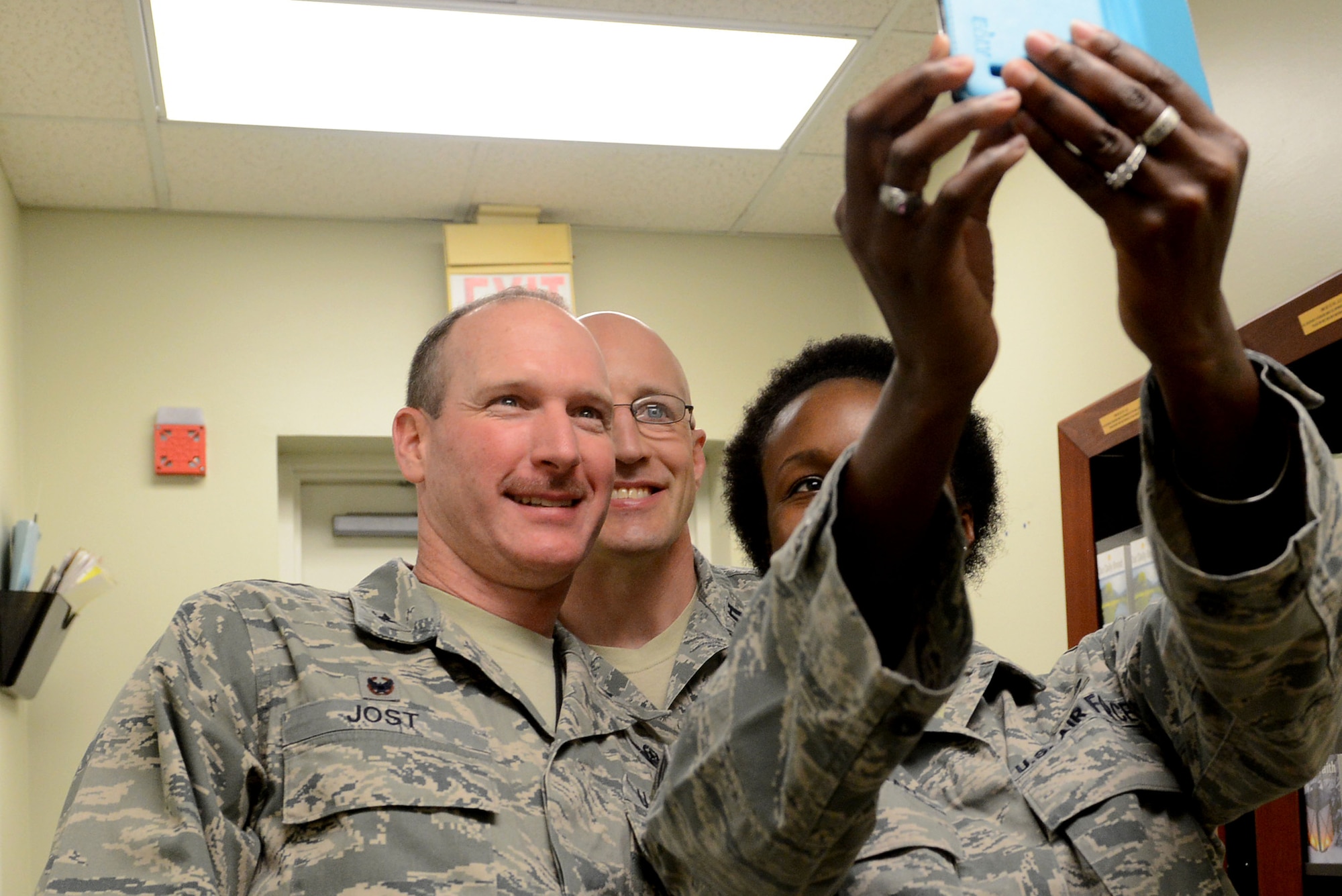 U.S. Air Force Col. Stephen Jost, 20th Fighter Wing commander, takes a selfie with Staff Sgt. Kimberly Swanagan, 20th FW chaplain assistant, and Chaplain (Capt.) Curt Cizek, 20th FW chaplain, during a Behind the Scenes event at Shaw Air Force Base, S.C., March 16, 2015. Jost joined the chaplains to experience a day in their shoes and learn more about their unique ministry plan. (U.S. Air Force photo by Senior Airman Diana M. Cossaboom/Released)
