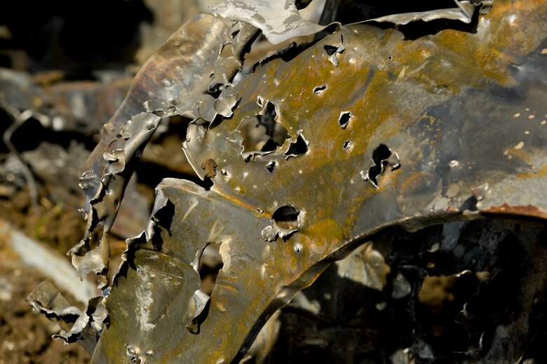 A dummy vehicle displays damage caused from rounds fired from a30mm GAU-8 Avenger rotary cannon on a U.S. Air Force A-10 Thunderbolt II assigned to the 354th Expeditionary Fighter Squadron during a theater security package deployment over the range at Campia Turzii, Romania, April 1, 2015. The pilots used the car as a target for the U.S. and Romanian air forces while aiming to strengthen interoperability and demonstrate the countries' shared commitment to the security and stability of Europe.  (U.S. Air Force photo by Staff Sgt. Joe W. McFadden/Released)