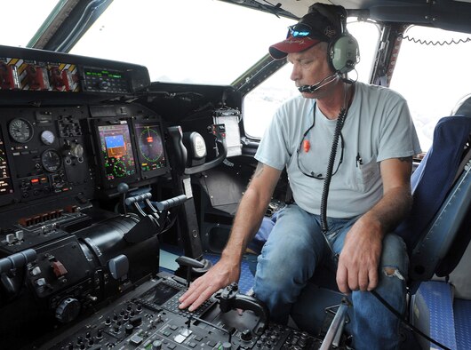 Mark Holland, 559th Aircraft Maintenance Squadron mechanic, performs post-flight inspections on a returning C-5M. (U.S. Air Force photo by Tommie Horton)