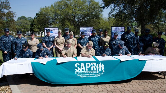 Leadership from Joint Base Charleston Weapons Station sign a proclamation declaring the month of April 2015 as sexual assault awareness and prevention month for Team Charleston April 1, 2015 at Joint Base Charleston – Weapons Station, S.C. The theme for sexual assault awareness month this year is “Eliminate Sexual Assault: Know your part. Do your part.” The purpose of sexual assault awareness month is to raise awareness about sexual assault prevention and support sexual assault survivors. (U.S. Air Force photo/Staff Sgt. AJ Hyatt)