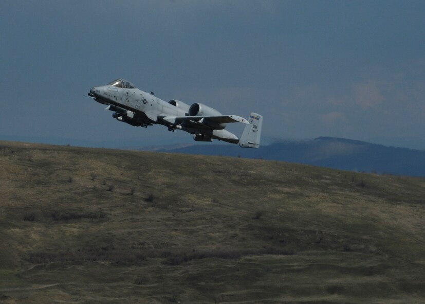 A U.S. Air Force A-10 Thunderbolt II assigned to the 354th Expeditionary Fighter Squadron flies during a theater security package deployment at Campia Turzii, Romania, April 1, 2015. The aircraft will forward deploy to locations in Eastern European NATO countries as part of the TSP. (U.S. Air Force photo by Staff Sgt. Joe W. McFadden/Released)