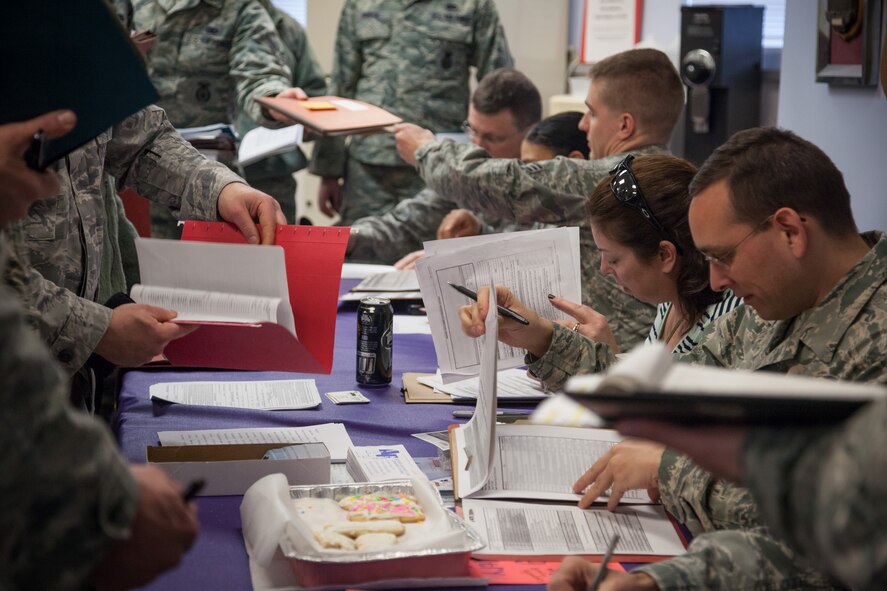 Members of the 934th Security Forces Squadron receive briefings and complete a personnel deployment function line, making sure everything is in order as they leave for pre-deployment training prior to their upcoming mission to Southwest Asia.  (U.S. Air Force photo by Shannon McKay/Released)