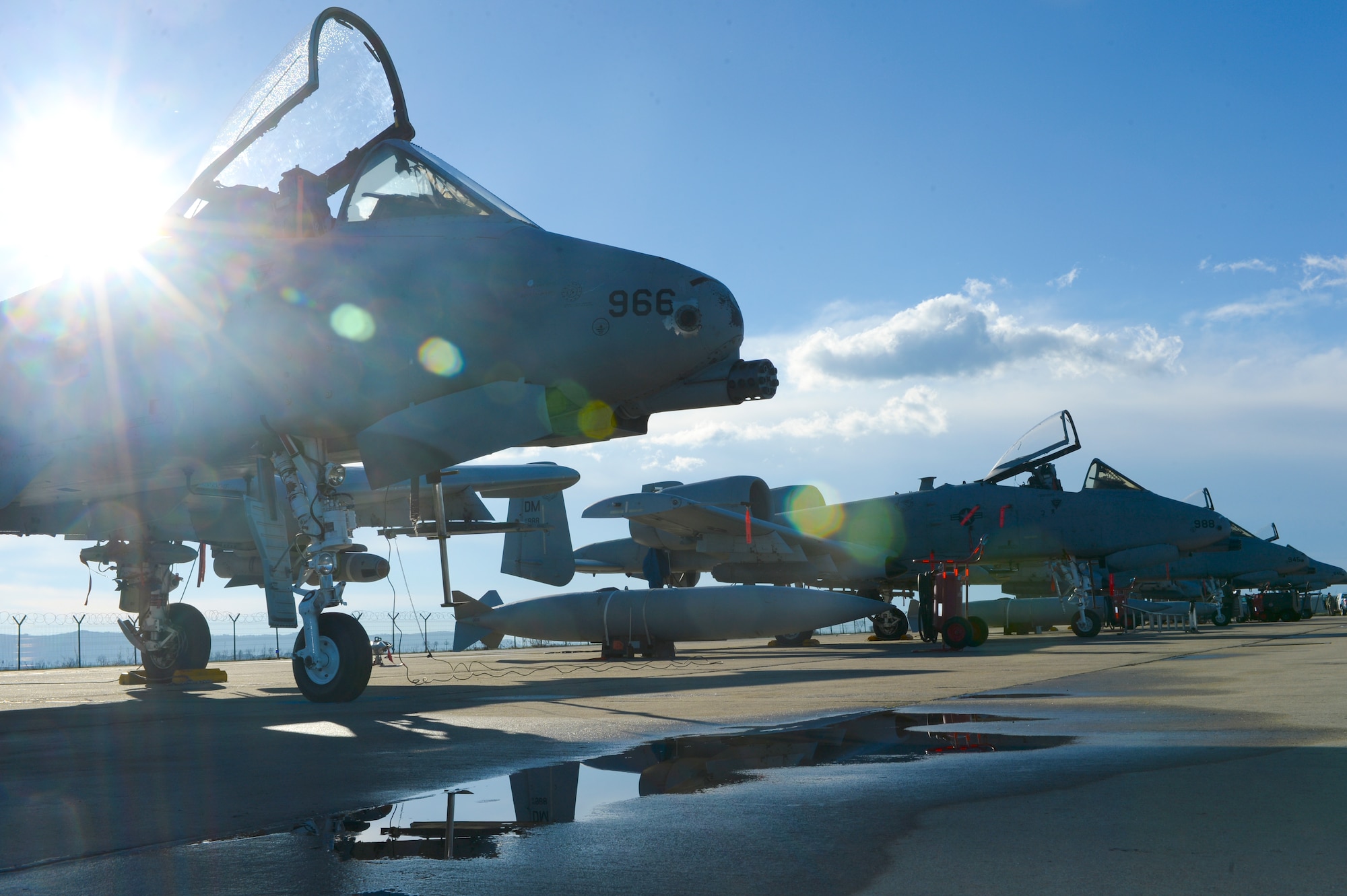 A row of U.S. Air Force A-10 Thunderbolt IIs assigned to the 354th Expeditionary Fighter Squadronare parked off the runway during a theater security package deployment at Campia Turzii, Romania, April 1, 2015.  The aircraft deployed to Romania in support of Operation Atlantic Resolve to bolster air power capabilities while underscoring the U.S. commitment to European security and stability. (U.S. Air Force photo by Staff Sgt. Joe W. McFadden/Released)