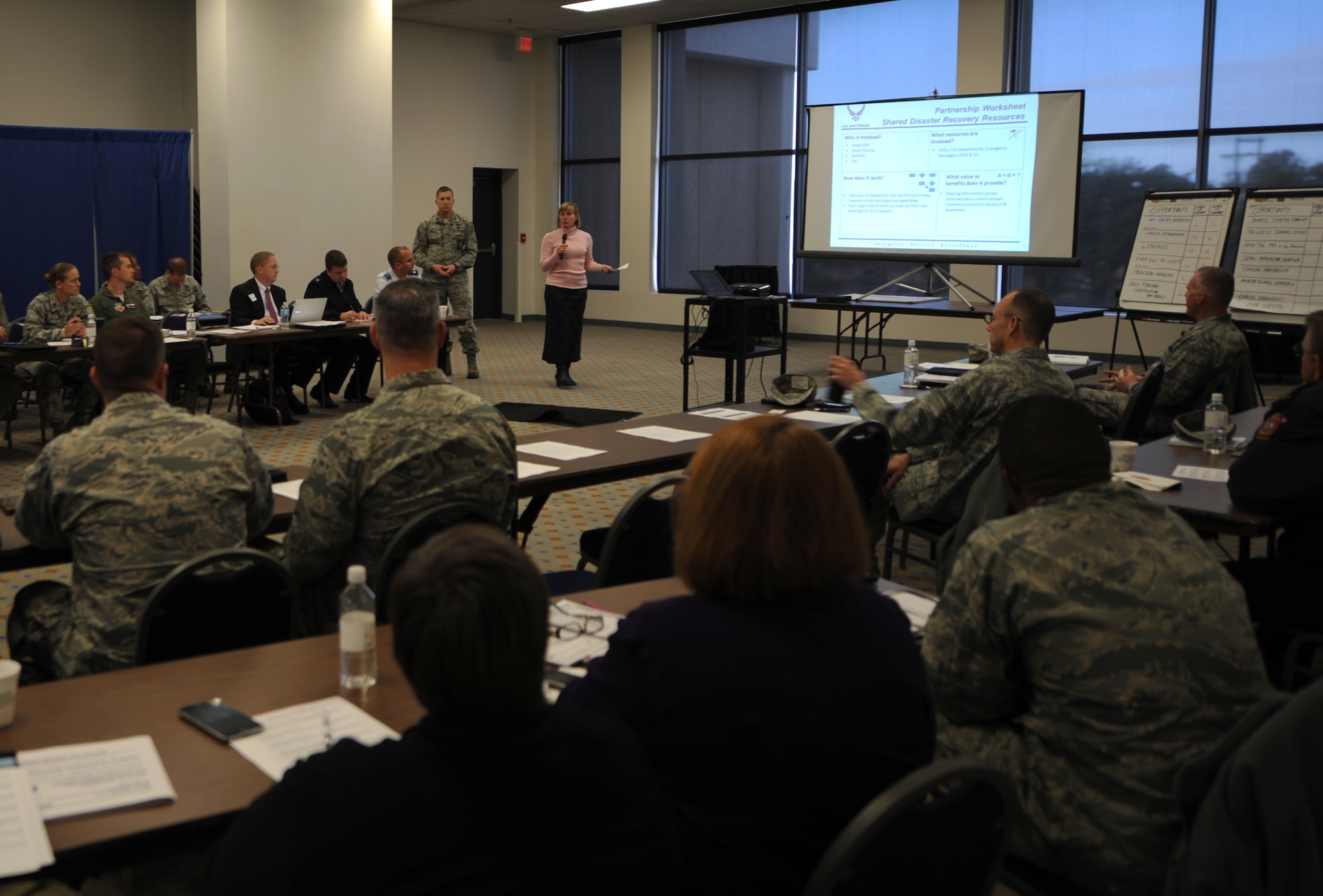 Megan R. Santee, Director of Public Works for the city of Abilene, speaks during an Air Force Community Partnership Program meeting Nov. 11, 2014, at Dyess Air Force Base, Texas. The goal of the program is to enhance mission viability and improve Airmen resiliency. It also implements collaborative projects that reduce operations and services costs, or reduce risks, and provide mutual value to the Air Force or Department of Defense and local communities. (U.S. Air Force photo by Airman 1st Class Alexander Guerrero/Released)