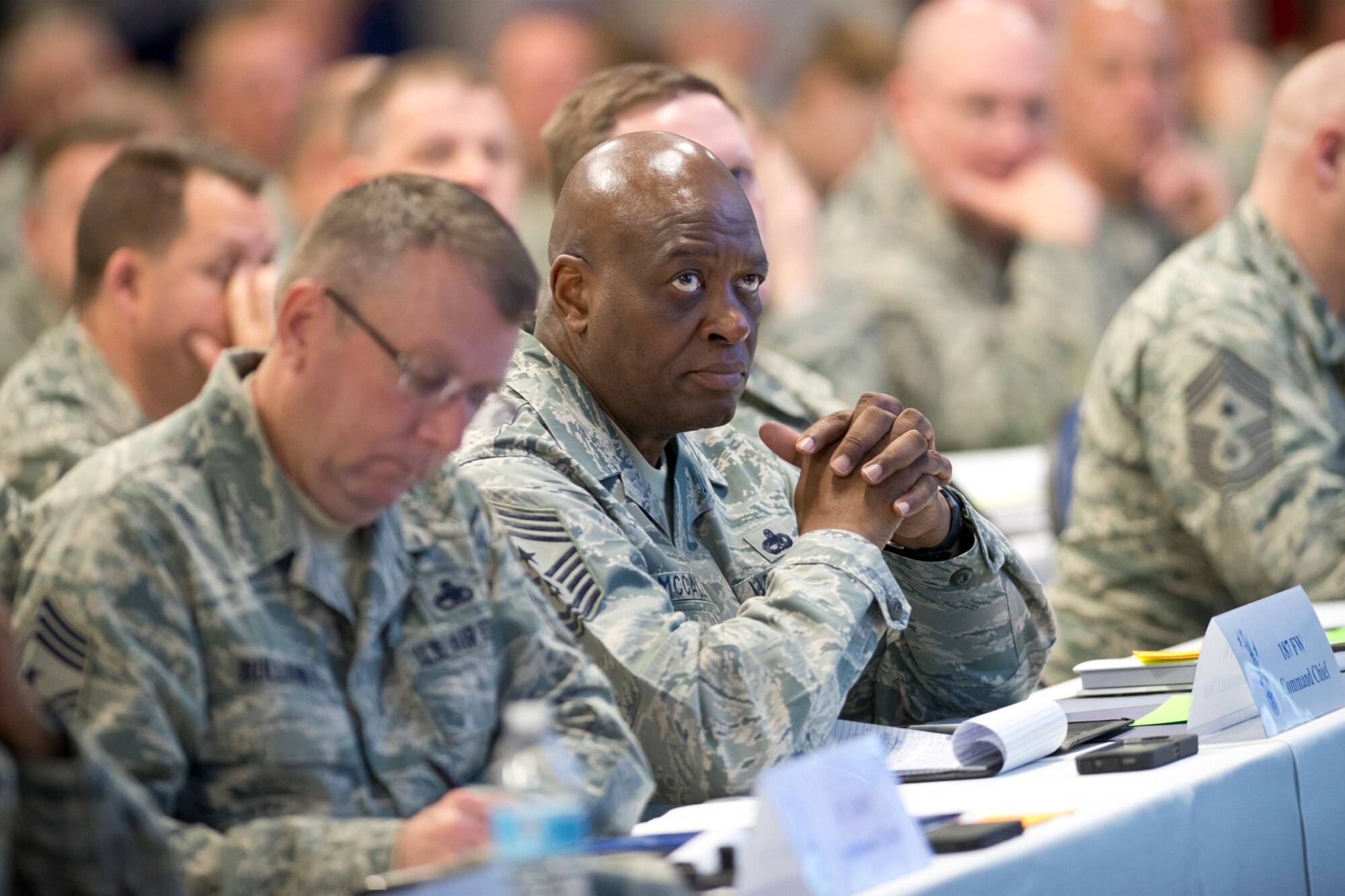 Command Chief Master Sgt. Lindsey McCall, command chief master sergeant of the 187th Fighter Wing, Alabama Air National Guard, listens to a presentation during the annual Command Chief’s Huddle at Volk Field Combat Readiness Training Center, Wis., March 28, 2015. The Command Chief’s Huddle brings together more than 150 Command Chief Master Sergeants and other senior enlisted leaders from 89 ANG wings and units, representing 54 states, territories and the District of Columbia, to openly discuss a wide range of issues and challenges facing the ANG. Attendees will also gain a better understanding of national issues relating to the ANG mission and share that knowledge with the 91,000 enlisted Air Guardsmen they represent. (U.S. Air National Guard photo by Master Sgt. Marvin R. Preston/Released)
