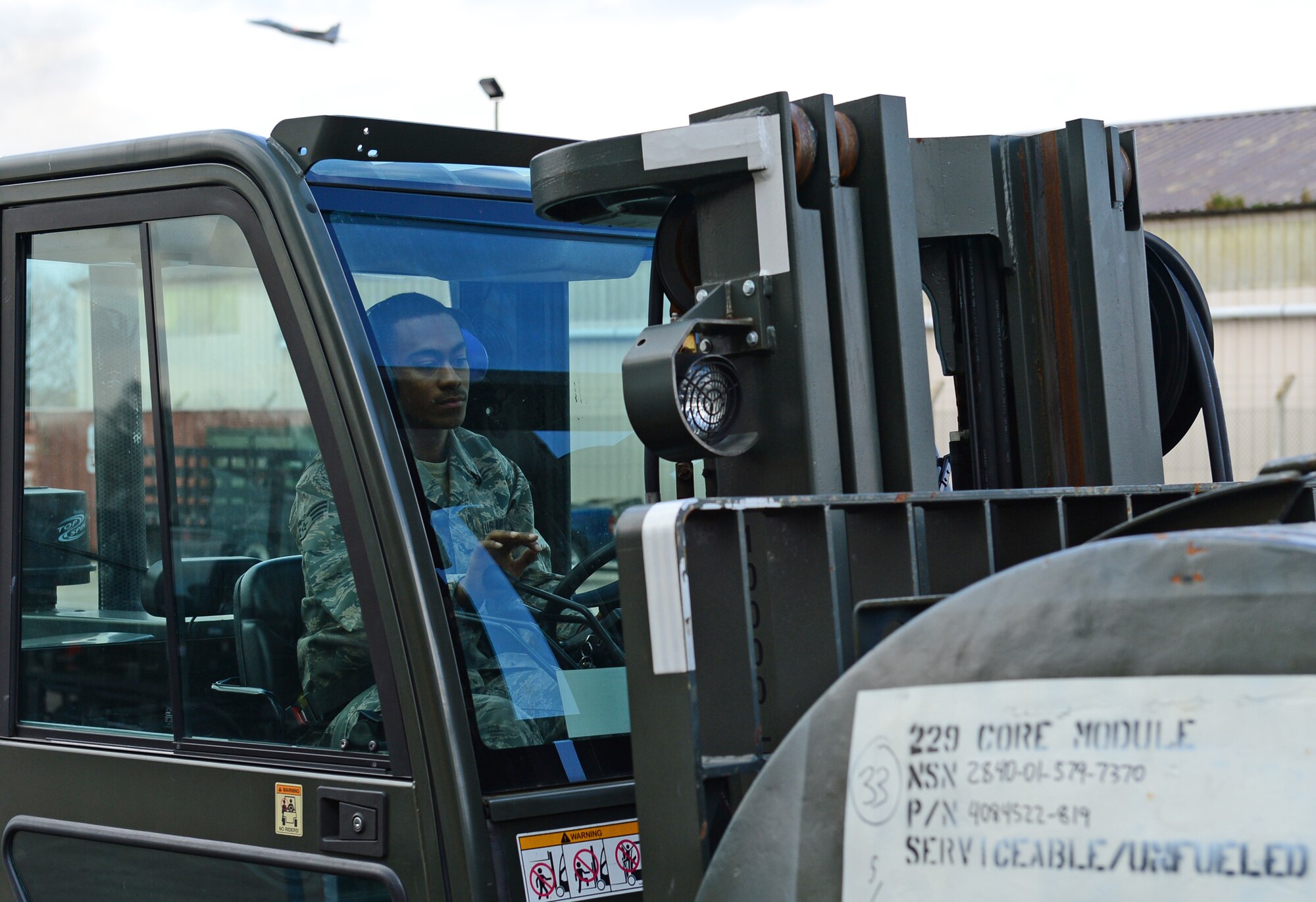 Airman 1st Class Lee Morris, 48th Logistics Readiness Squadron assistant traffic management journeyman, weighs cargo for shipment at Royal Air Force Lakenheath, England, March 23, 2015. Morris was nominated for a Liberty Spotlight because he embodies the core value of Service Before Self. (U.S. Air Force photo by Airman 1st Class Erin R. Babis/Released)