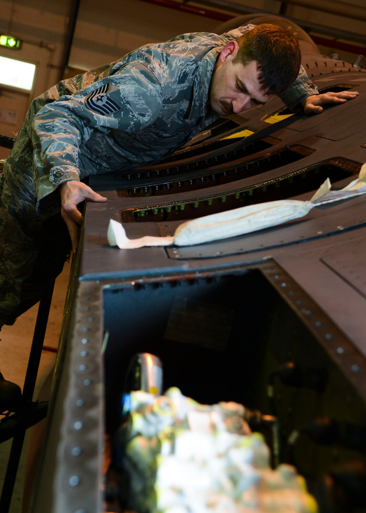 U.S. Air Force Tech. Sgt. Donald Hannant, 31st Maintenance Squadron assistant flight chief, checks F-16 Fighting Falcon connection points, March 31, 2015, at Aviano Air Base, Italy. The 31 MXS will ship the wing stateside for refurbishment so it may be used again on another Falcon. (U.S. Air Force photo by Senior Airman Austin Harvill/Released)