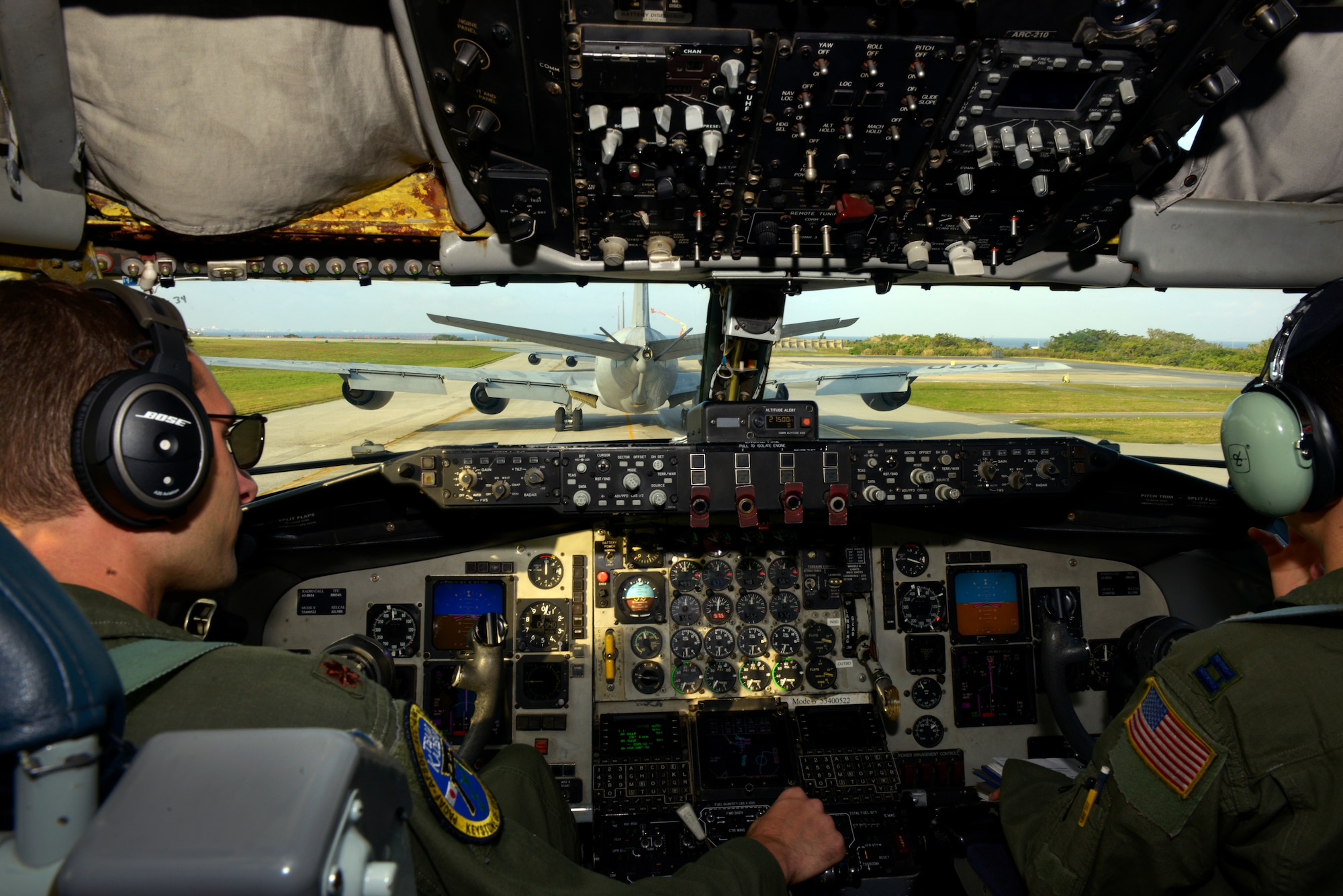 U.S. Air Force Maj. Christopher Marriott and Capt. Alexandra Trana, both KC-135 Stratotanker pilots from the 909th Air Refueling Squadron, taxi behind several other KC-135s during an elephant walk as part of  the Forceful Tiger exercise on Kadena Air Base, Japan, April 1, 2015. During the aerial exercise, the Stratotankers delivered 800,000 pounds of fuel to approximately 50 aircraft. (U.S. Air Force photo by Staff Sgt. Maeson L. Elleman)
