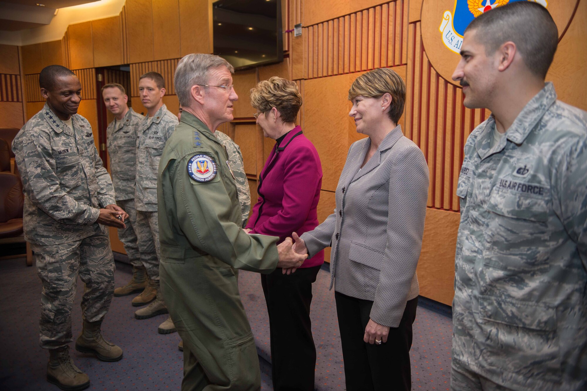 RAMSTEIN AIR BASE, Germany – Gen. Hawk Carlisle, Air Combat Command commander (center), and Gen. Darren W. McDew, Air Mobility Command commander (left), present coins to key individuals responsible for the execution of the Combat Air Forces/Mobility Air Forces Commander’s Conference on Ramstein Air Base, Germany, April 1, 2015. The conference provided a venue for the senior leaders to discuss current and future issues central to the Air Force. (U.S. Air Force photo/Tech. Sgt. Benjamin Wilson)