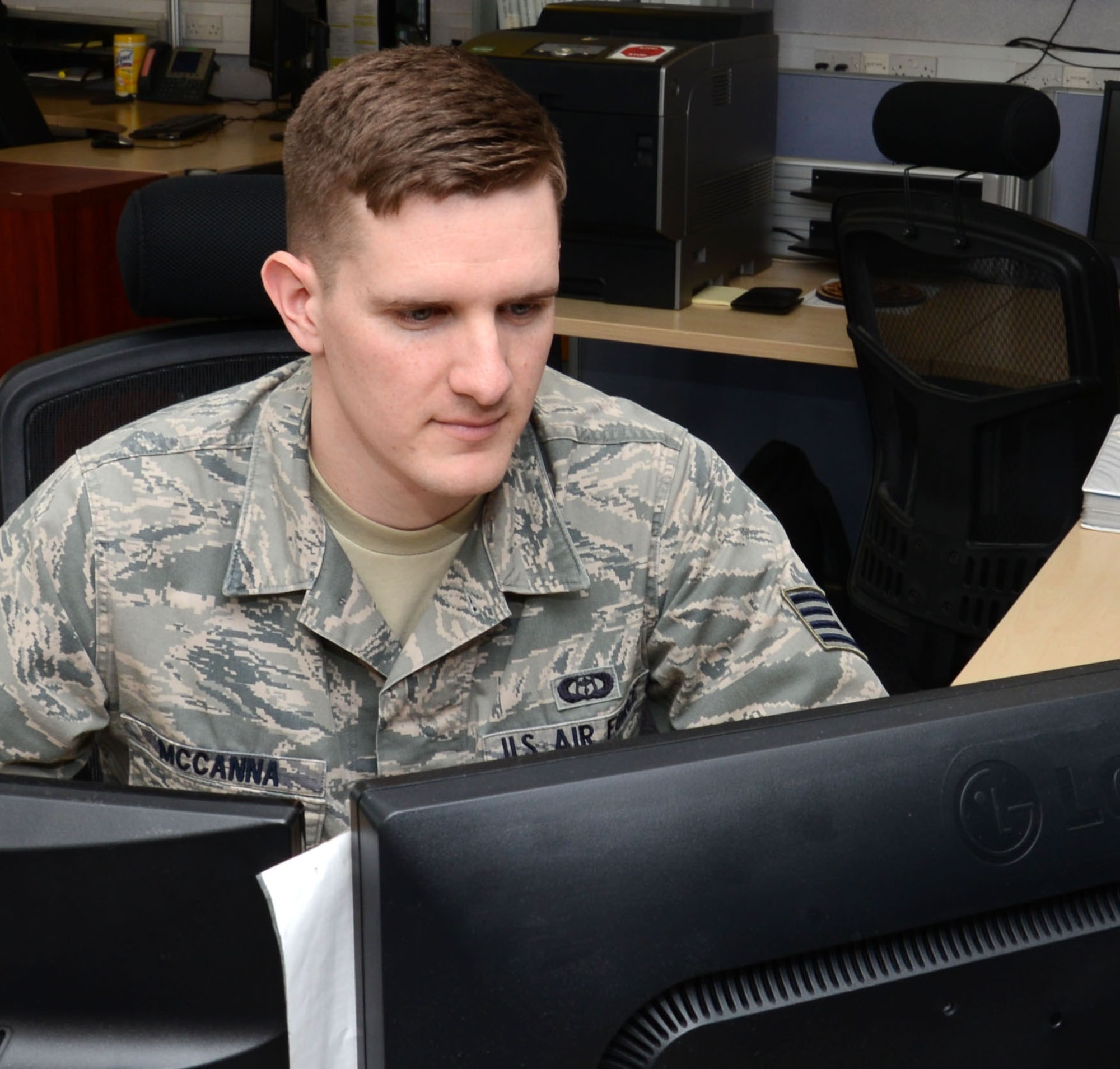 U.S Air Force Staff Sgt. Samuel McCanna, 100th Operations Support Squadron weather forecaster from Newark, Ohio, prepares a mission brief March 27, 2015, on RAF Mildenhall, England. McCanna was awarded the Square D Spotlight for displaying the core value of Excellence in All We Do. (U.S. Air Force photo by Gina Randall/Released)