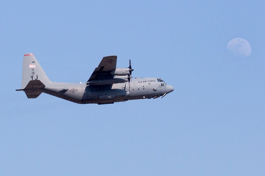 A C-130 Hercules from the 36th Airlift Squadron flies over Yokota Air Base, Japan, March 30, 2015, during a jump week. (U.S. Air Force photo by Osakabe Yasuo/Released)