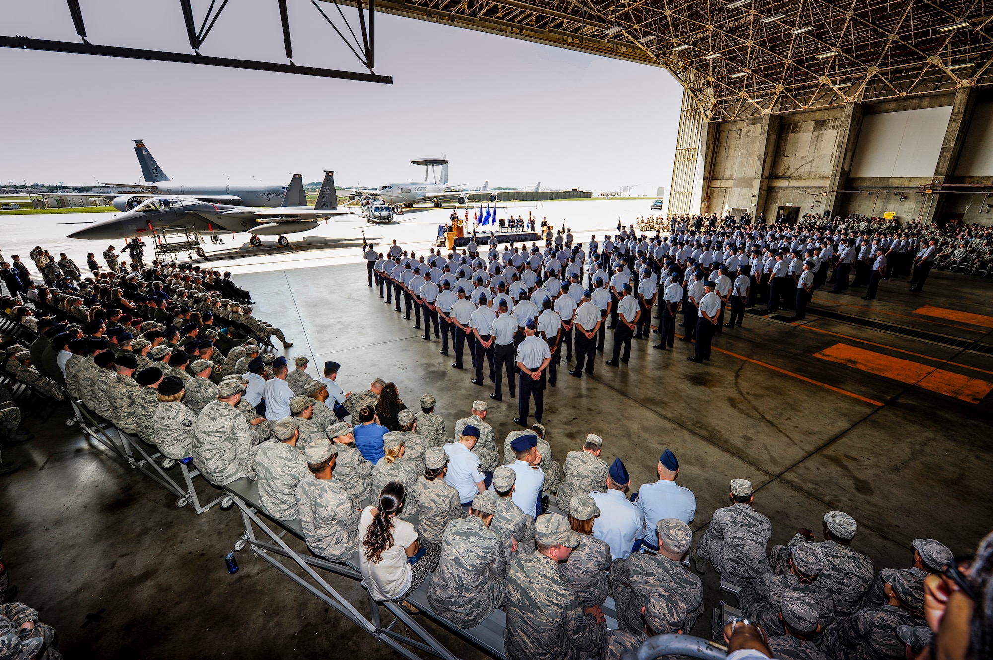 Members of Team Kadena observe the 18th Wing change of command ceremony on Kadena Air Base, Japan, April 2, 2015. The mission of the 18th Wing is to deliver unmatched combat airpower and a forward-staging base to provide sovereign options that promote peace and stability in the Asia-Pacific region. Its current fleet of aircraft represents a broad spectrum of combat capability and is now commanded by Brig. Gen. Barry Cornish. (U.S. Air Force photo by Airman 1st Class John Linzmeier)