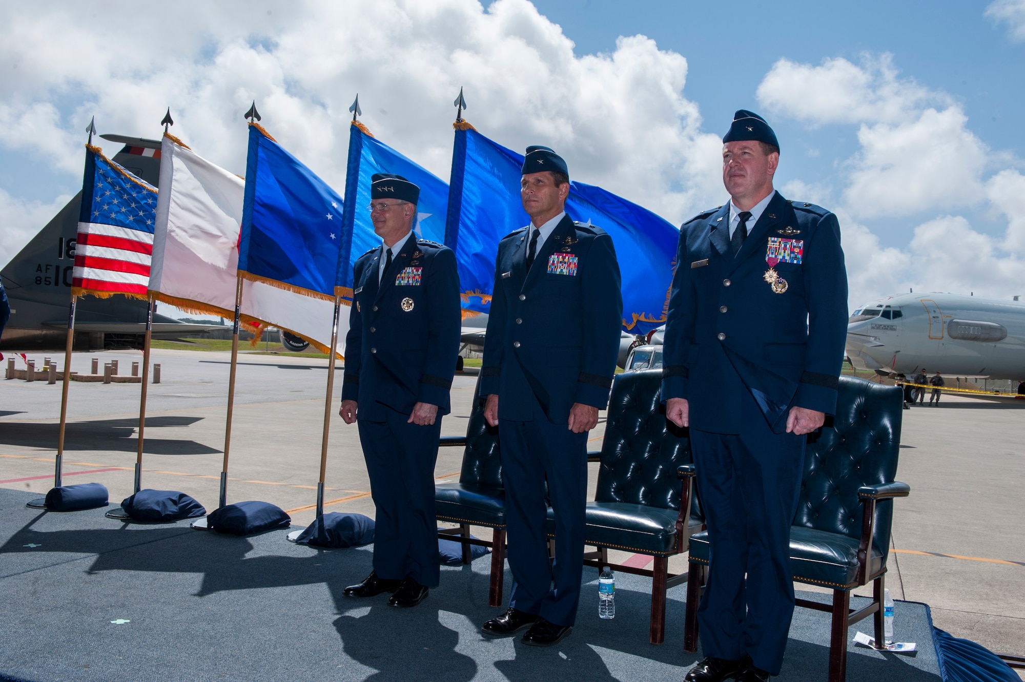 From left, U.S. Air Force Lt. Gen. Sam Angelella, U.S. Forces Japan and 5th Air Force commander, Brig. Gen. Barry Cornish, 18th Wing commander, and Brig. Gen. James Hecker, former 18th Wing commander, stand at attention during the Air Force Song at the end of the 18th Wing change of command ceremony on Kadena Air Base, Japan, April 2, 2015. Cornish now commands nearly 18,000 Americans and more than 4,000 Japanese employees and contractors who make up Team Kadena. (U.S. Air Force photo by Airman 1st Class Stephen G. Eigel)