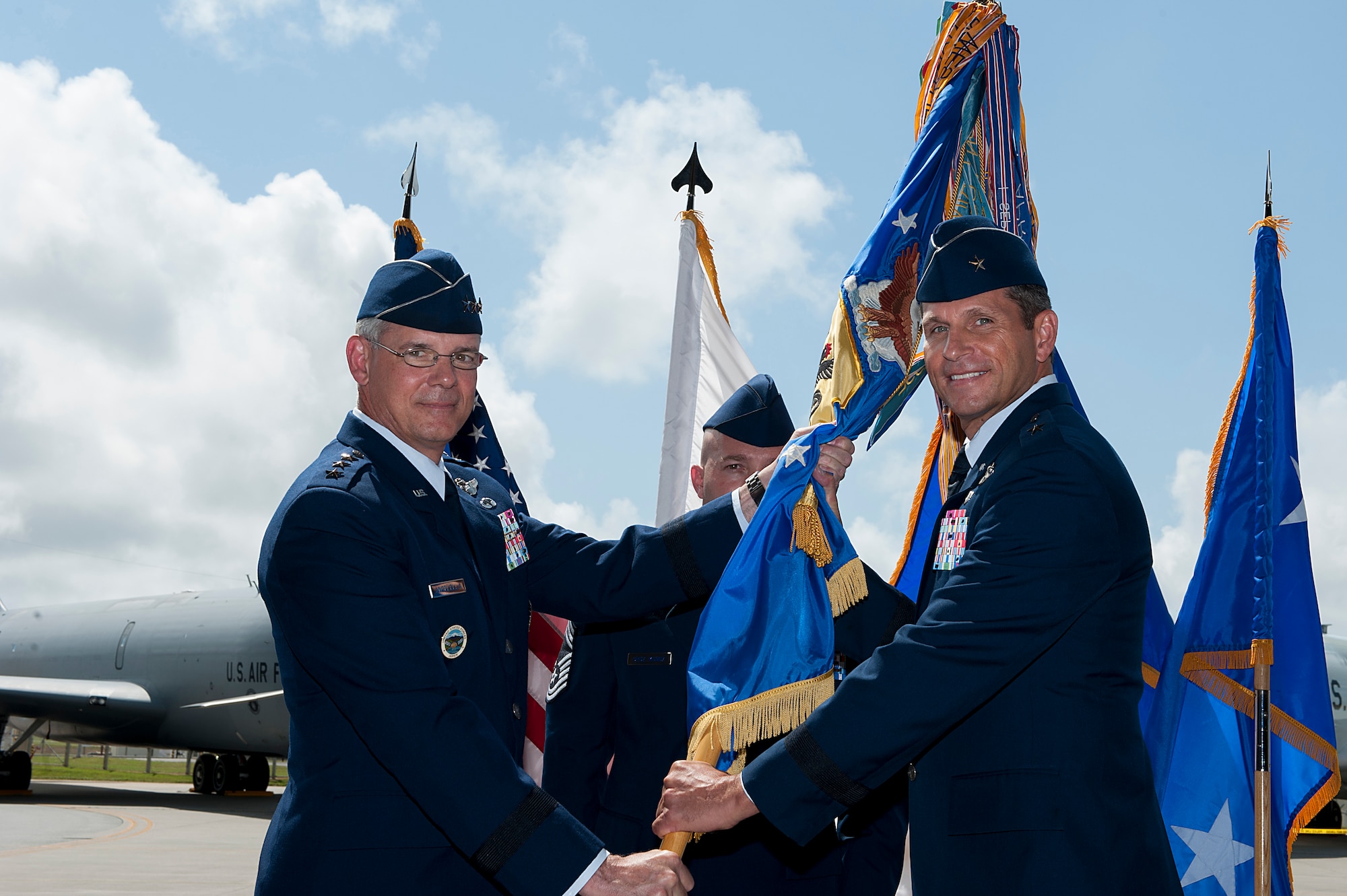 U.S. Air Force Brig. Gen. Barry Cornish (right), 18th Wing commander, receives the guidon from Lt. Gen. Sam Angelella (left), U.S. Forces Japan and 5th Air Force commander, during the 18th Wing change of command ceremony on Kadena Air Base, Japan, April 2, 2015. Cornish most recently served as an executive officer for Pacific Air Forces Command, Joint Base Pearl Harbor–Hickam, Hawaii. (U.S. Air Force photo by Airman 1st Class Stephen G. Eigel)