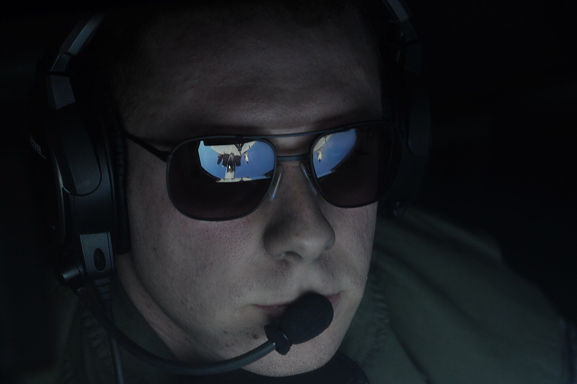 U.S. Air Force Senior Airman Justin Gillespie, 909th Air Refueling Squadron boom operator, refuels a U.S. Air Force F-15C Eagle from Kadena Air Base, Japan during  the Forceful Tiger exercise over the Pacific Ocean, April 1, 2015. KC-135 Stratotankers from the 909th ARS delivered more than 800,000 pounds of fuel to the 50 aircraft participating in the aerial exercise. (U.S. Air Force photo by Airman 1st Class Zade C. Vadnais)