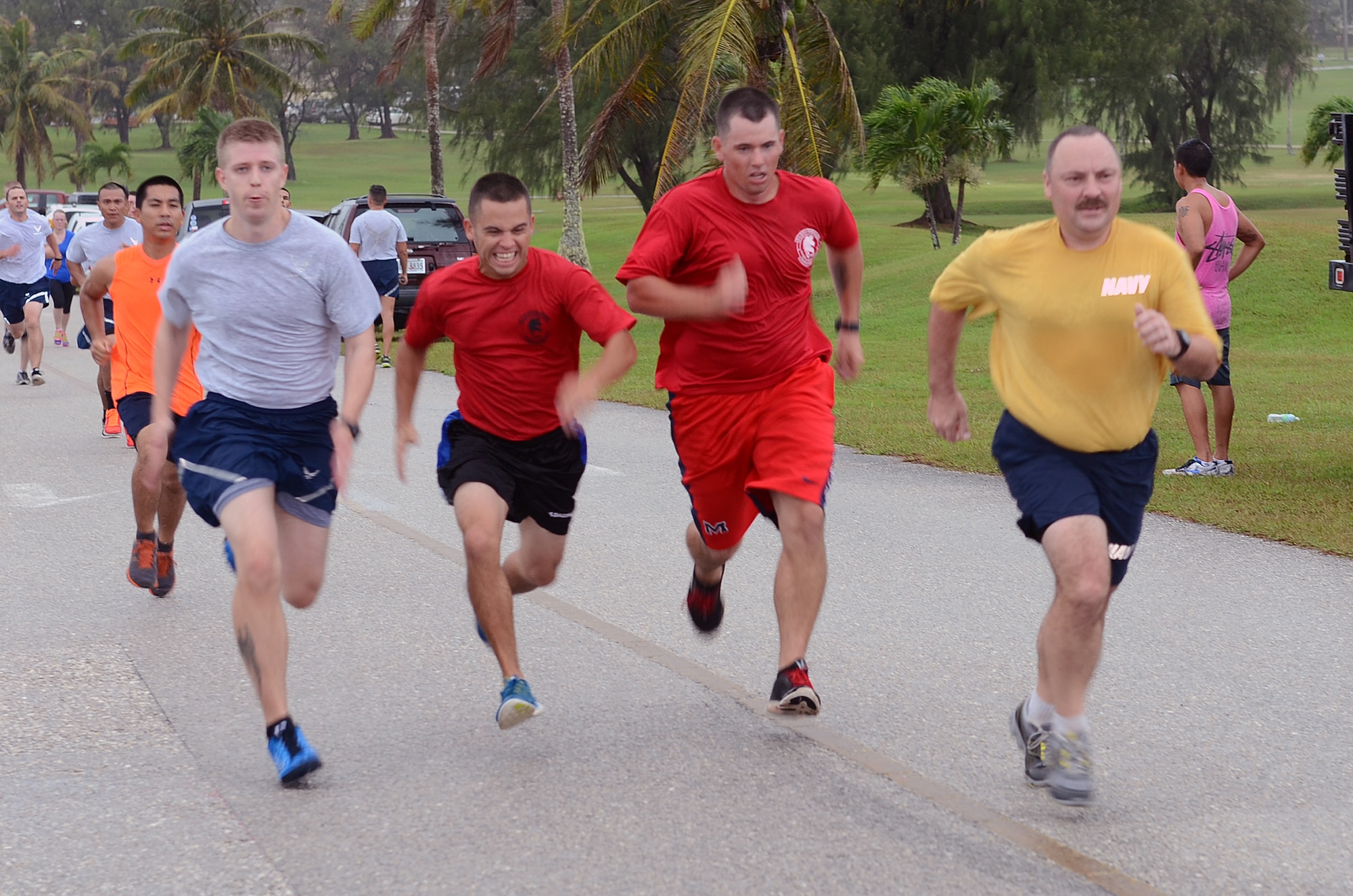 Runners compete to finish first during the April Fool’s 5K at the Palm Tree Golf Course on Andersen Air Force Base, Guam, April 1, 2015. As an April Fool’s Day joke, runners were told by event coordinators the course had been changed to a half marathon instead of a 5K. (U.S. Air Force photo by Airman 1st Class Alexa Ann Henderson/Released)