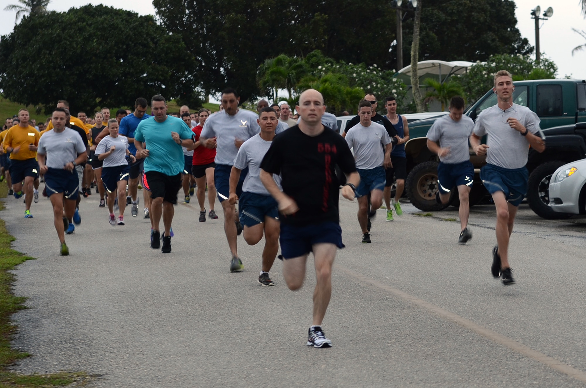 Team Andersen members start the April Fool’s 5K at the Palm Tree Golf Course on Andersen Air Force Base, Guam, April 1, 2015. As an April Fool’s Day joke, runners were told by event coordinators the course had been changed to a half marathon instead of a 5K. (U.S. Air Force photo by Airman 1st Class Alexa Ann Henderson/Released)