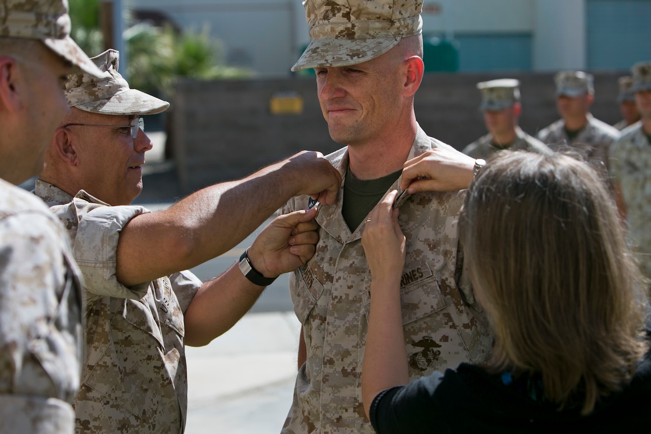 Marine Corps Master Sgt. Thomas Draffen is promoted to master gunnery sergeant at Marine Corps Air Station Yuma, Ariz., April 1, 2015. Draffen was promoted by retired Master Gunnery Sgt. Michael Arnett, who was his drill instructor at boot camp. U.S. Marine Corps photo by Cpl. Xzavior T. McNeal