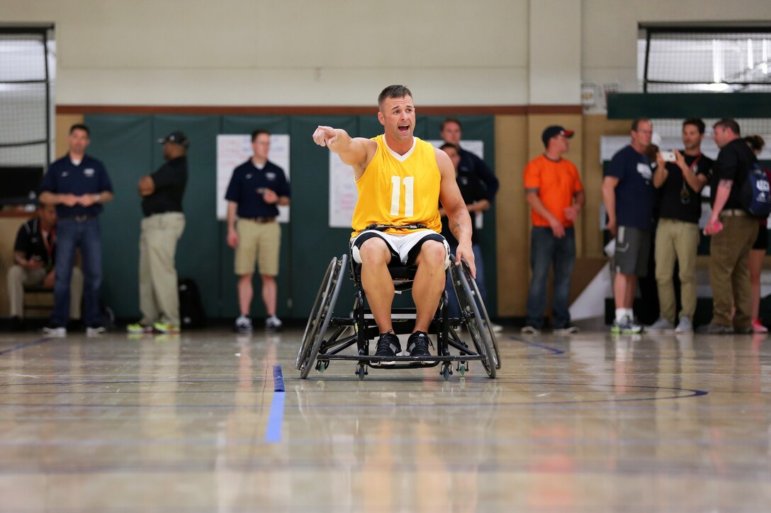 Army Sgt. Joshua Wirth directs his team down the court during the wheelchair basketball gold medal game during the 2015 Army Trials on Fort Bliss in El Paso, Texas, March 31, 2015.