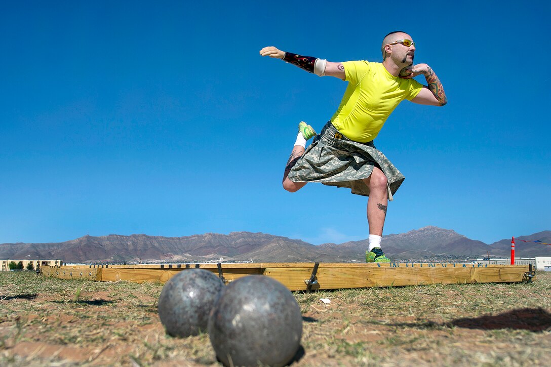 Army veteran Andy McCaffrey throws a shot put during the Army Trials on Fort Bliss in El Paso, Texas, April 1, 2015. About 100 wounded, ill or injured soldiers and veterans are on the base to train and compete in athletic events, which include archery, cycling, shooting, sitting volleyball, swimming, wheelchair basketball and track and field, through April 2. The trials help determine who will get a spot on the Army's team for the Department of Defense Warrior Games 2015 in June on Marine Corps Base Quantico, Va. 