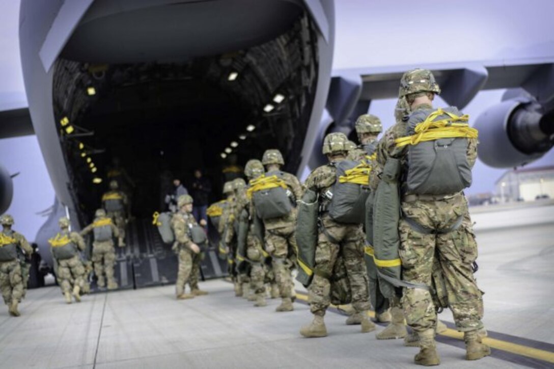 U.S. Army paratroopers board a C-17 Globemaster on Aviano Air Base, Italy, March 24, 2015, as part of an emergency deployment exercise in Grafenwoehr, Germany.