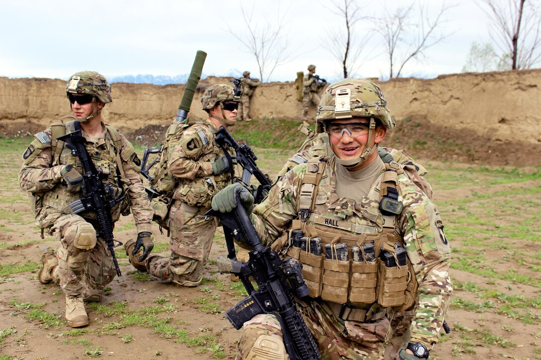 U.S. Army Staff Sgt. Hall and fellow soldiers take a knee during a break while patrolling through a village near Bagram Airfield, Afghanistan, March 24, 2015. Hall is assigned to the 101st Airborne Division's 3rd Battalion, 187th Infantry.