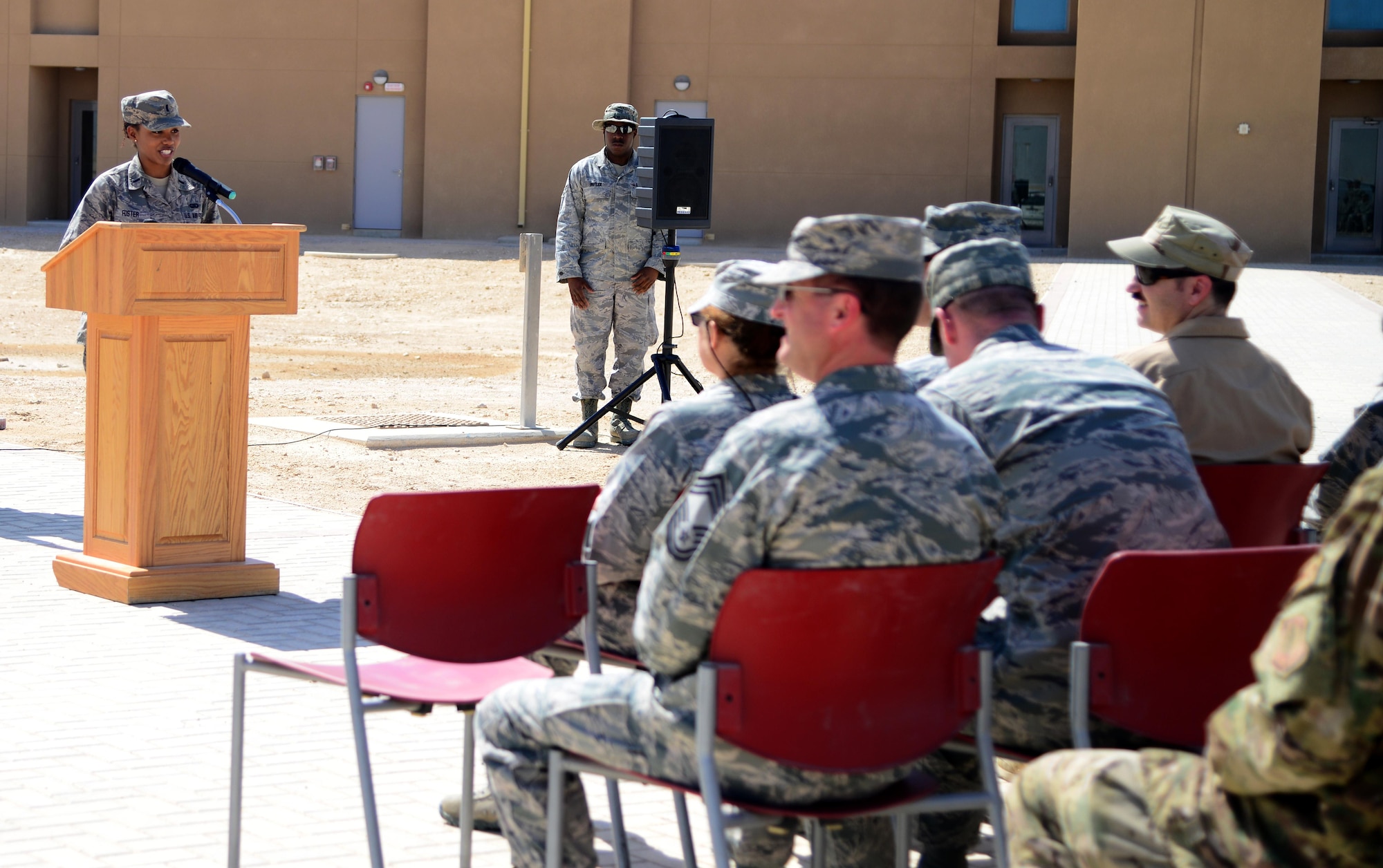 U.S. Air Force 1st Lt. Alisha Foster,  379th Expeditionary Force Support Squadron deputy sustainment flight commander, gives opening remarks during a linen cutting ceremony, April 3, 2015, at Al Udeid Air Base, Qatar. The linen cutting ceremony symbolized the opening of the new Phase II dormitories in the Blatchford-Preston Complex. (U.S. Air Force photo by Senior Airman Kia Atkins)