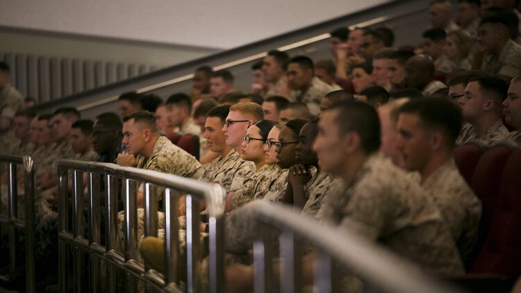 Okinawa-based personnel listen during a town hall meeting with Gen. Joseph F. Dunford March 25 at the Camp Foster Theater in Okinawa, Japan. Dunford, the 36th Commandant of the Marine Corps, traveled to Okinawa to speak to Marines and sailors about his planning guidance, which outlines his vision for the Marine Corps. Dunford also answered questions on topics such as women in the infantry, the growing field of cyber warfare and the Corps’ tattoo policy. The Marines are with various units under III Marine Expeditionary Force and Marine Corps Installations Pacific- Marine Corps Base Camp Butler, Japan. 