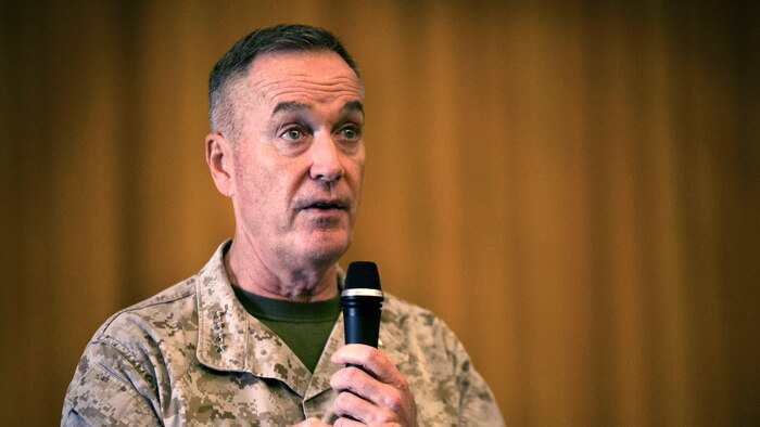 Commandant of the Marine Corps, Gen. Joseph F. Dunford addresses Okinawa-based personnel during a town hall meeting March 25 at the Camp Foster Theater. Dunford traveled to Okinawa to speak about his planning guidance, which outlines his vision for the Marine Corps. Dunford also answered questions, touching on topics such as women in the infantry, the growing field of cyber warfare and the Corps’ tattoo policy. 