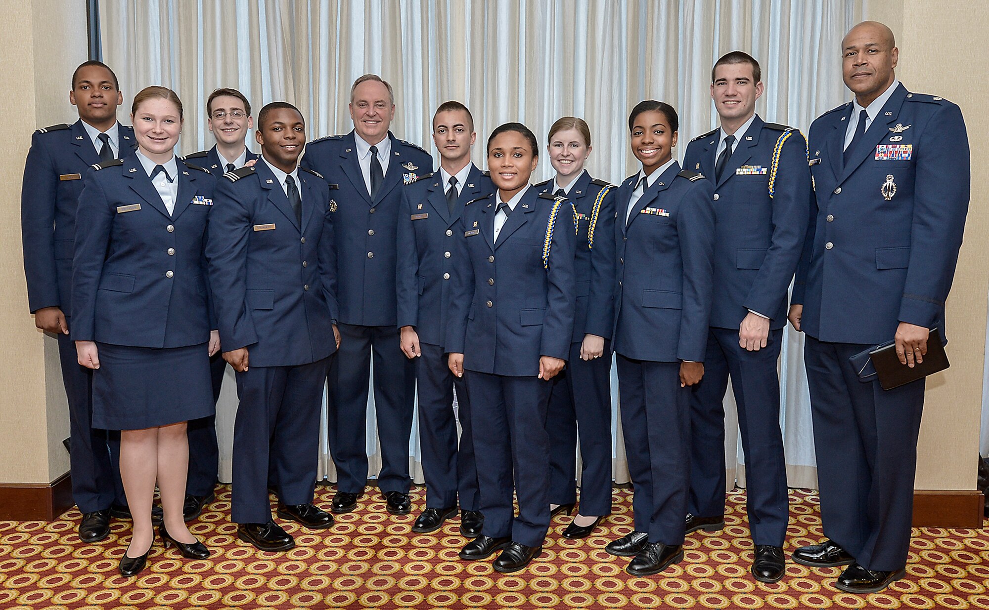 Air Force Chief of Staff Gen. Mark Welsh III, fifth from left, poses with a group of Reserve Officers Training Corps (ROTC) cadets who will be commissioned through Howard University this spring.  The future Air Force officers attended the Air Force Association's Breakfast Series which was held in Arlington, Va., April 2, 2015.  (U.S. Air Force Photo/Michael J. Pausic) 