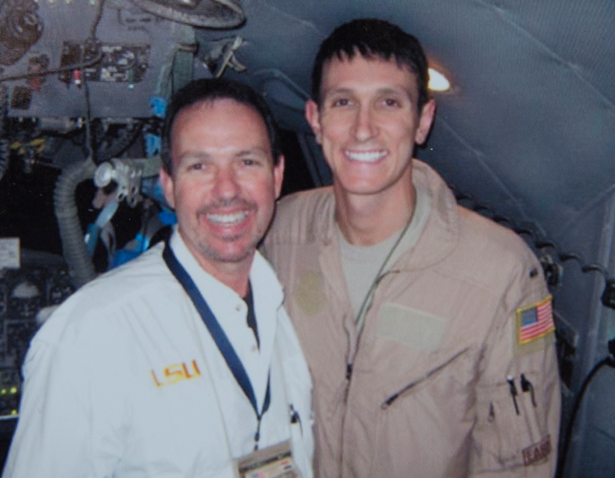 First Lt. Kenneth Jubb, a C-130J Super Hercules, stands next to his father, Stephen Jubb, in Southwest Asia. Stephen traveled to the Middle East to teach the locals how to properly control air traffic while Kenneth was deployed close by. Stephen took advantage of the opportunity and was able to direct his son’s landing for the first time during a mission. (Courtesy photo) 