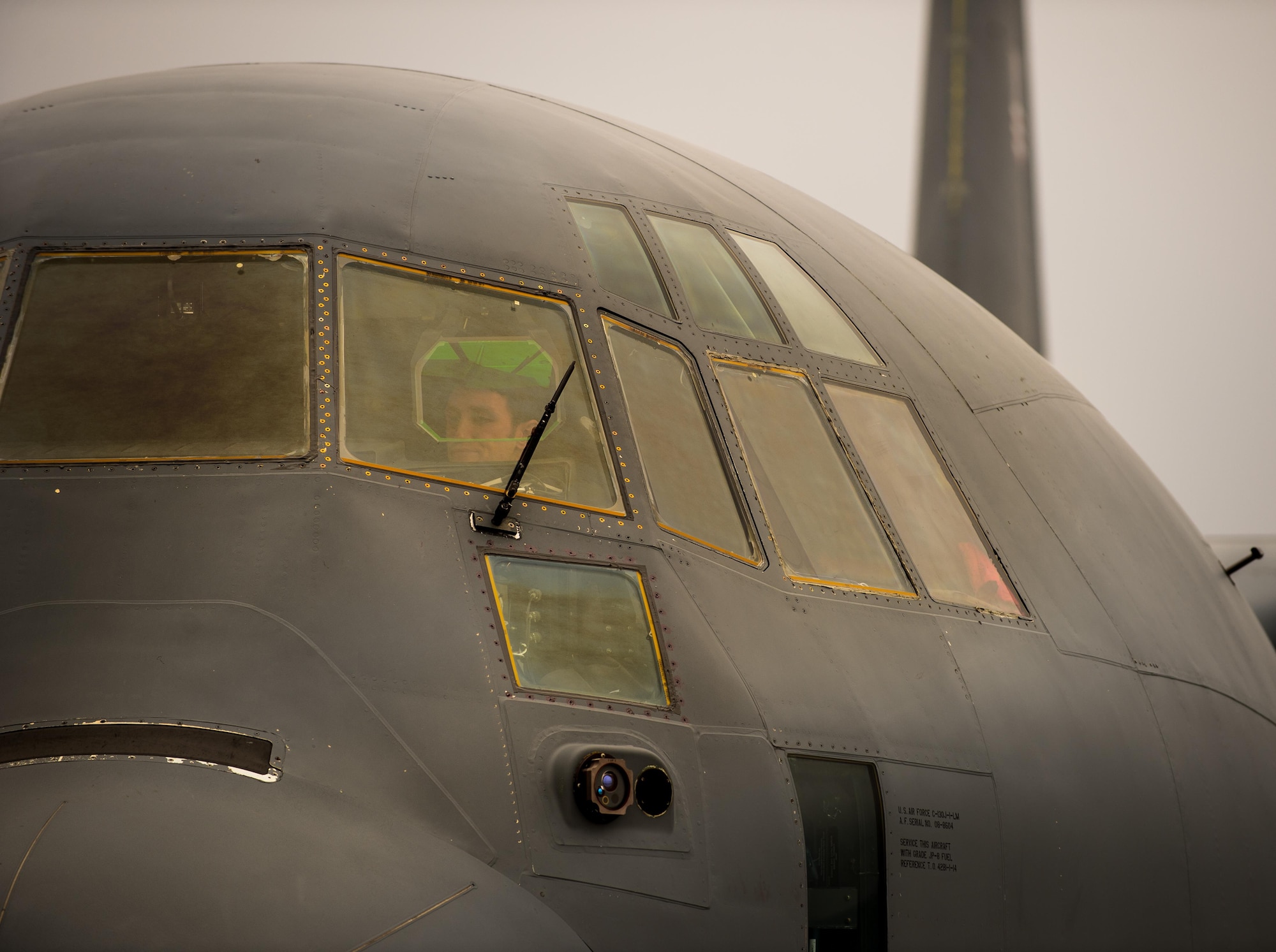 Capt. Kenneth Jubb, a 37th Airlift Squadron pilot, performs preflight checks in a C-130J Super Hercules for a training mission at Ramstein Air Base, Germany, Jan. 22, 2015. Since he was a child, Jubb has chased a dream to one day fly, and now as a pilot he relives his childhood fantasy every time he takes to the air. (U.S. Air Force photo/Senior Airman Jonathan Stefanko)