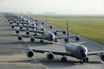 KADENA AIR BASE, Japan (Apr. 1, 2015) - Twelve U.S. Air Force KC-135 Stratotankers from the 909th Air Refueling Squadron taxi onto the runway during the Forceful Tiger exercise.  During the aerial exercise, the Stratotankers delivered 800,000 pounds of fuel to approximately 50 aircraft. 