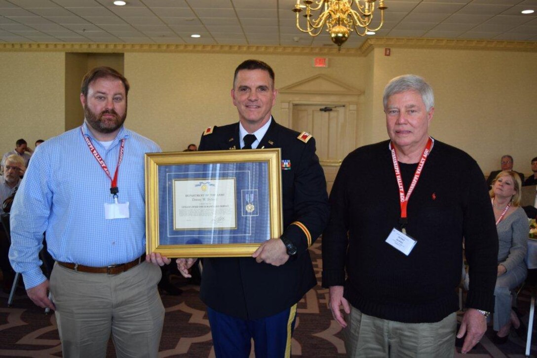 Feb. 26, 2015 - At the construction Roundtable in Jackson, Miss., hosted by the Mississippi Valley Branch of Associated General Contractors. Memphis District Commander Col. Jeff Anderson (center) presents the Army's Civilian Award for Humanitarian Service to representatives of Patton Tully Transportation Co. They are accepting on behalf of one of their employees, a contract Quality Control Representative. He, together with one of our Memphis District employees, decisively reacted with hands-on assistance, and courageously rescued a drowning woman near Island 18, Missouri, on the Mississippi River. Their quick and determined actions were directly instrumental in the successful rescue of a human life that otherwise would have been lost. Their selfless dedication to duty and personal courage reflect great credit upon themselves, Patton Tully Transportation Company, and the U.S. Army Corps of Engineers.