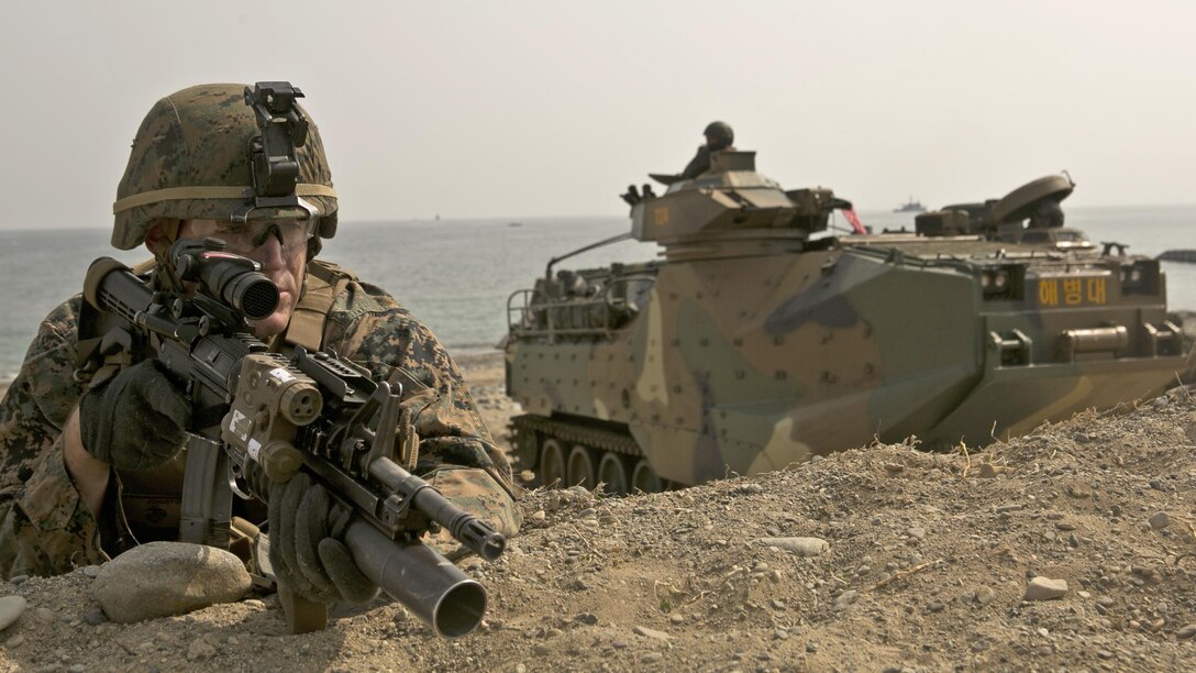 U.S. Marine Cops Cpl. Gary Johnston provides security during a beach landing exercise with Republic of Korea Marines in the vicinity of Pohang, South Korea, March 29, 2015. The 31st Marine Expeditionary Unit participated in  Korean Marine Exchange Program 15. The overall objective of KMEP 15 is to enhance amphibious operations between ROK and U.S. forces that contributes to security and stability on the Korean Peninsula as well as the entire Asia-Pacific region. Johnston is with Company G, Battalion Landing Team 2nd Battalion, 4th Marine Regiment, 31st MEU.